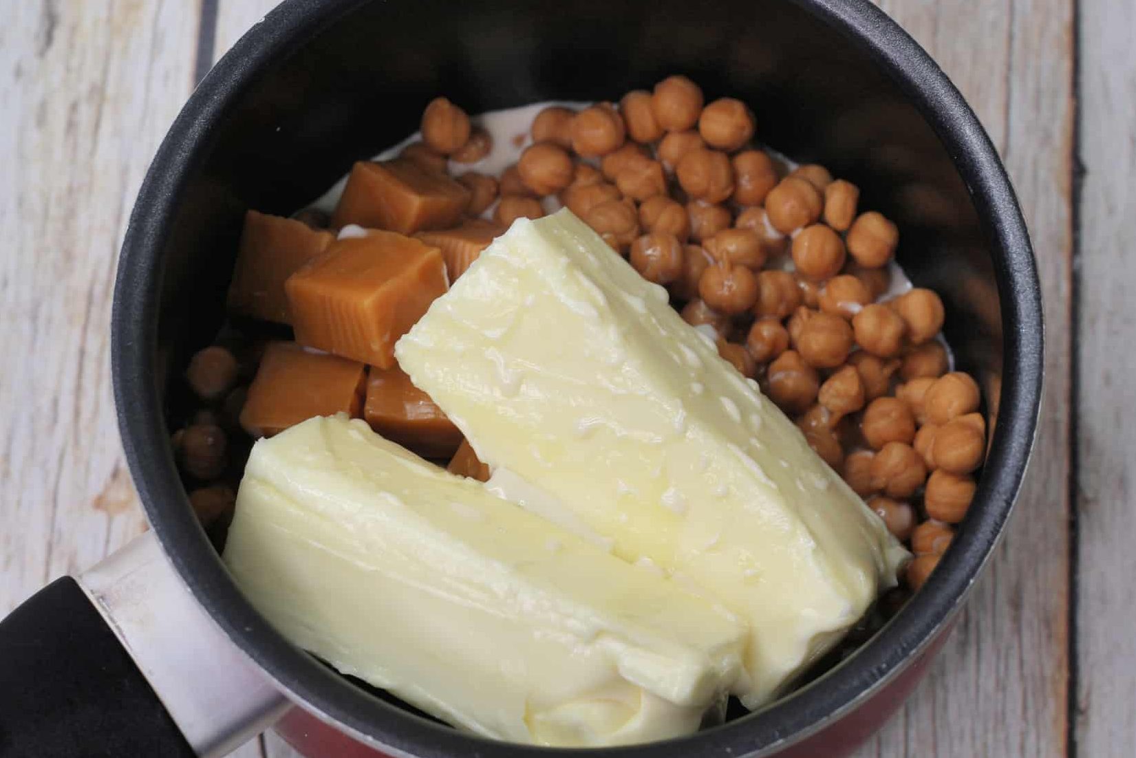 Using a saucepan, combine the caramel bits, butter, and evaporated milk and bring to medium heat.