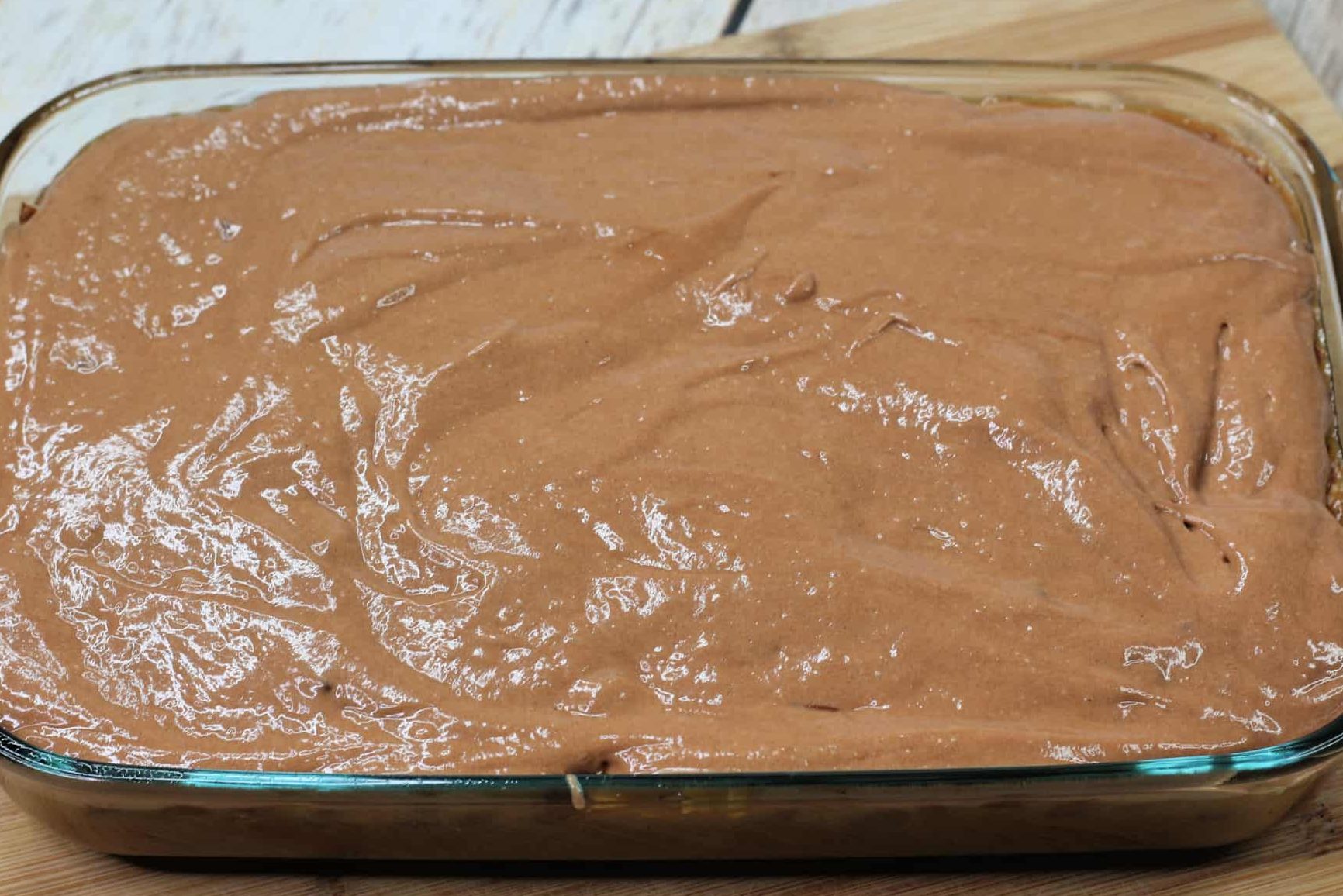 Pour the remaining cake batter on top of the caramel mixture and place it back into the oven to bake for 20 minutes.