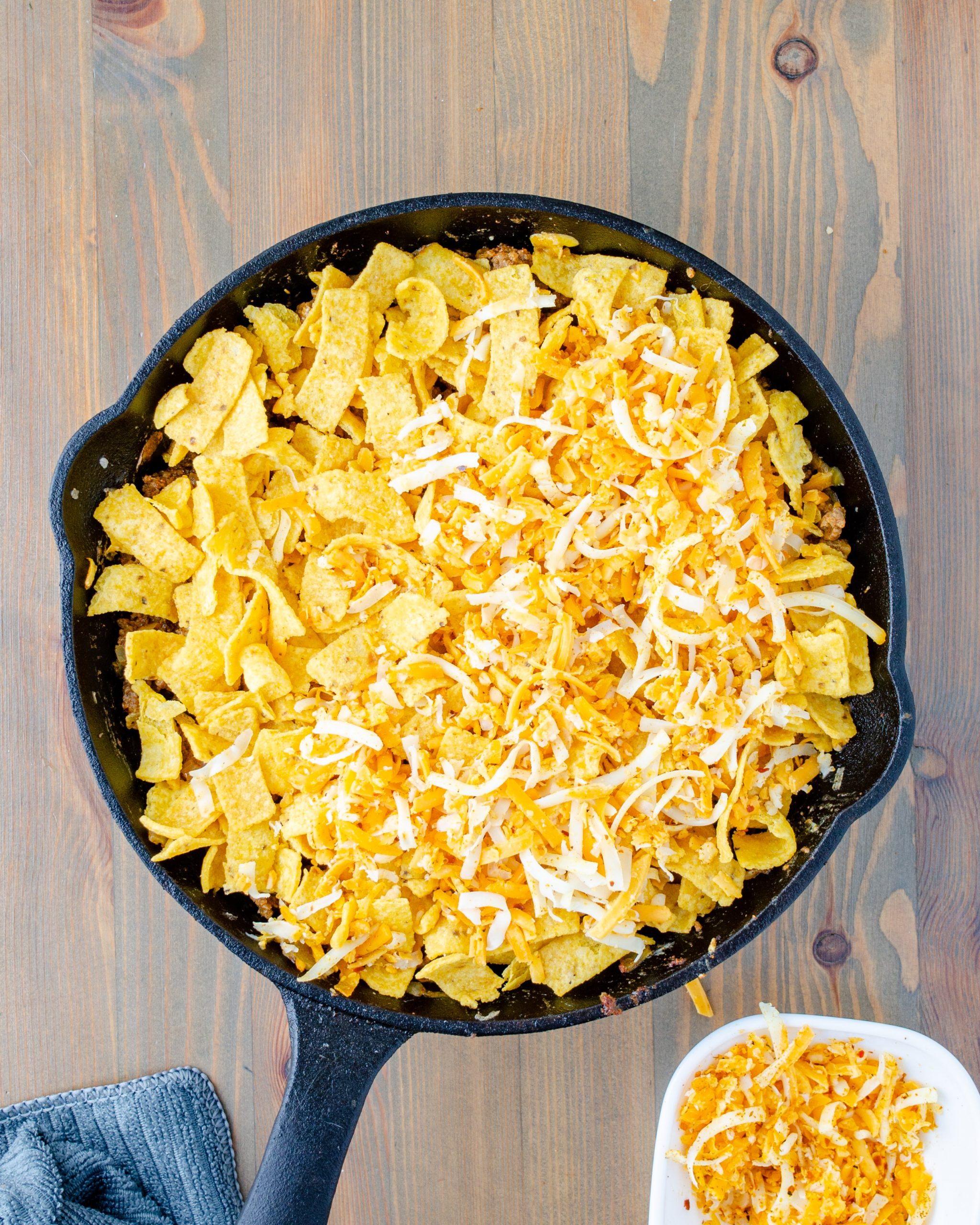 Top the mixture with the corn chips