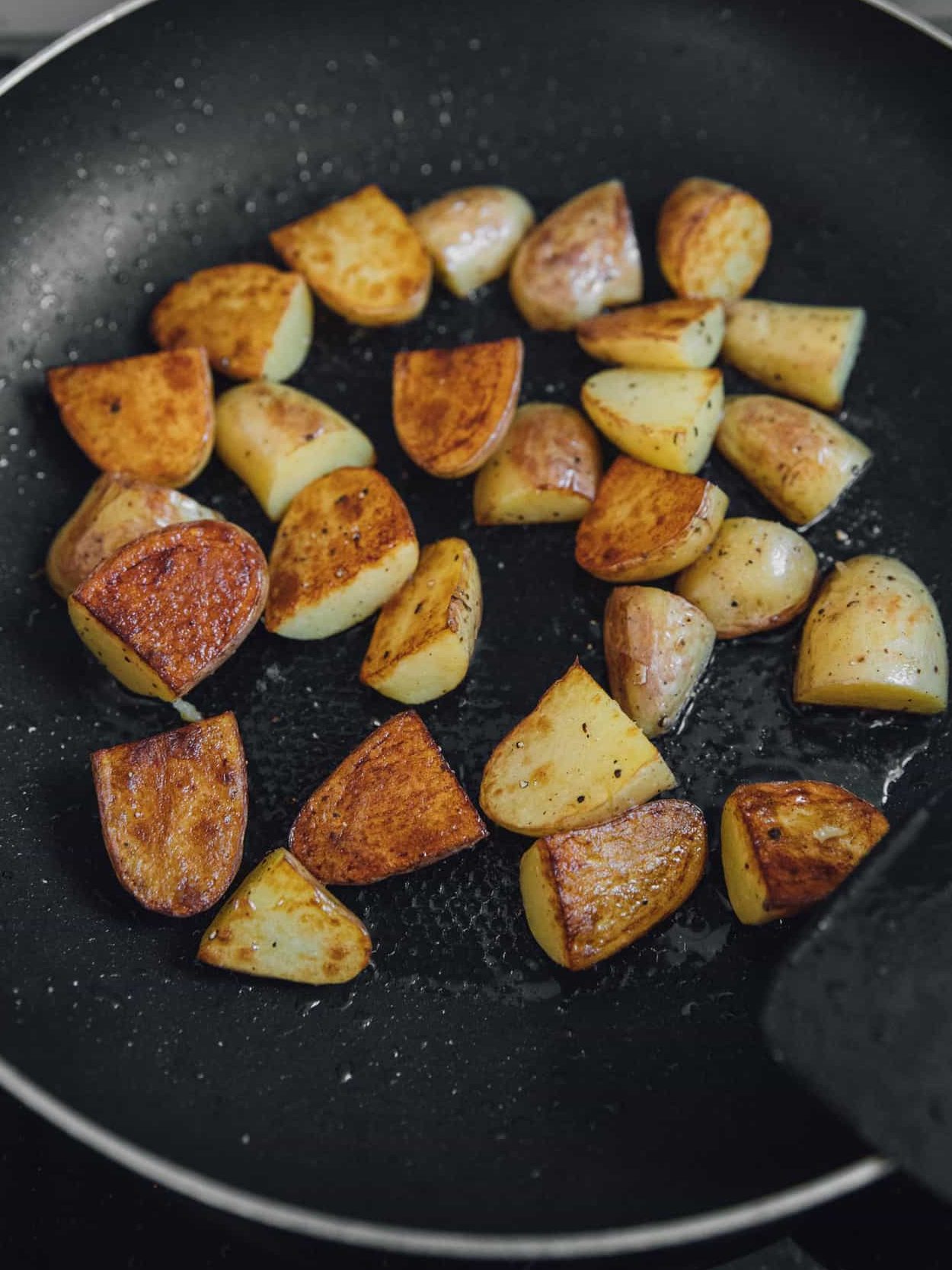 Add the baby potatoes, salt, and pepper. Sauté the potatoes for about 10 minutes or until they turn golden brown.