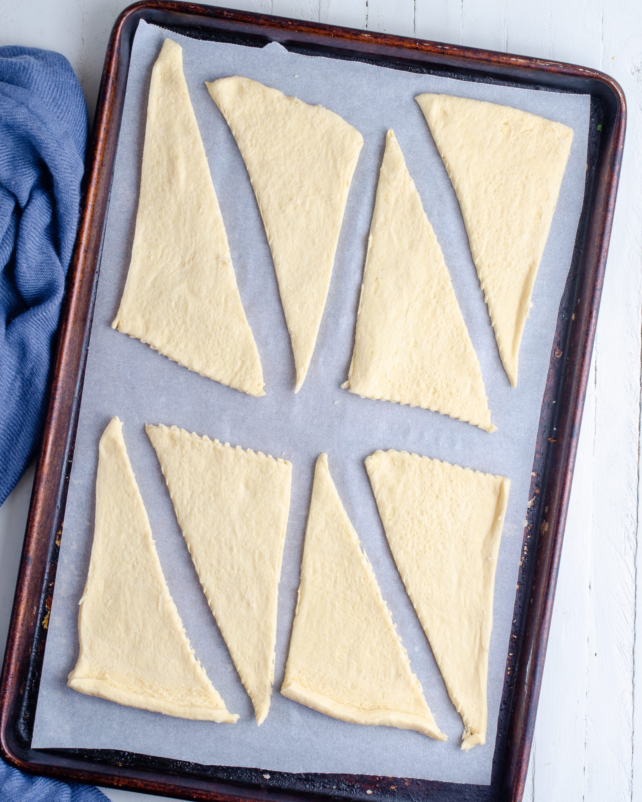 Unroll the crescent roll dough, and separate each triangle individually. 