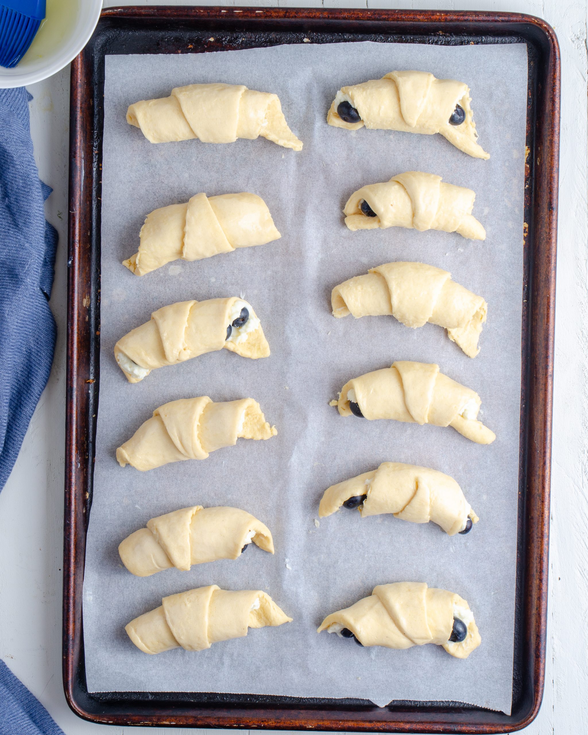 Brush the filled crescent rolls with the egg white. 