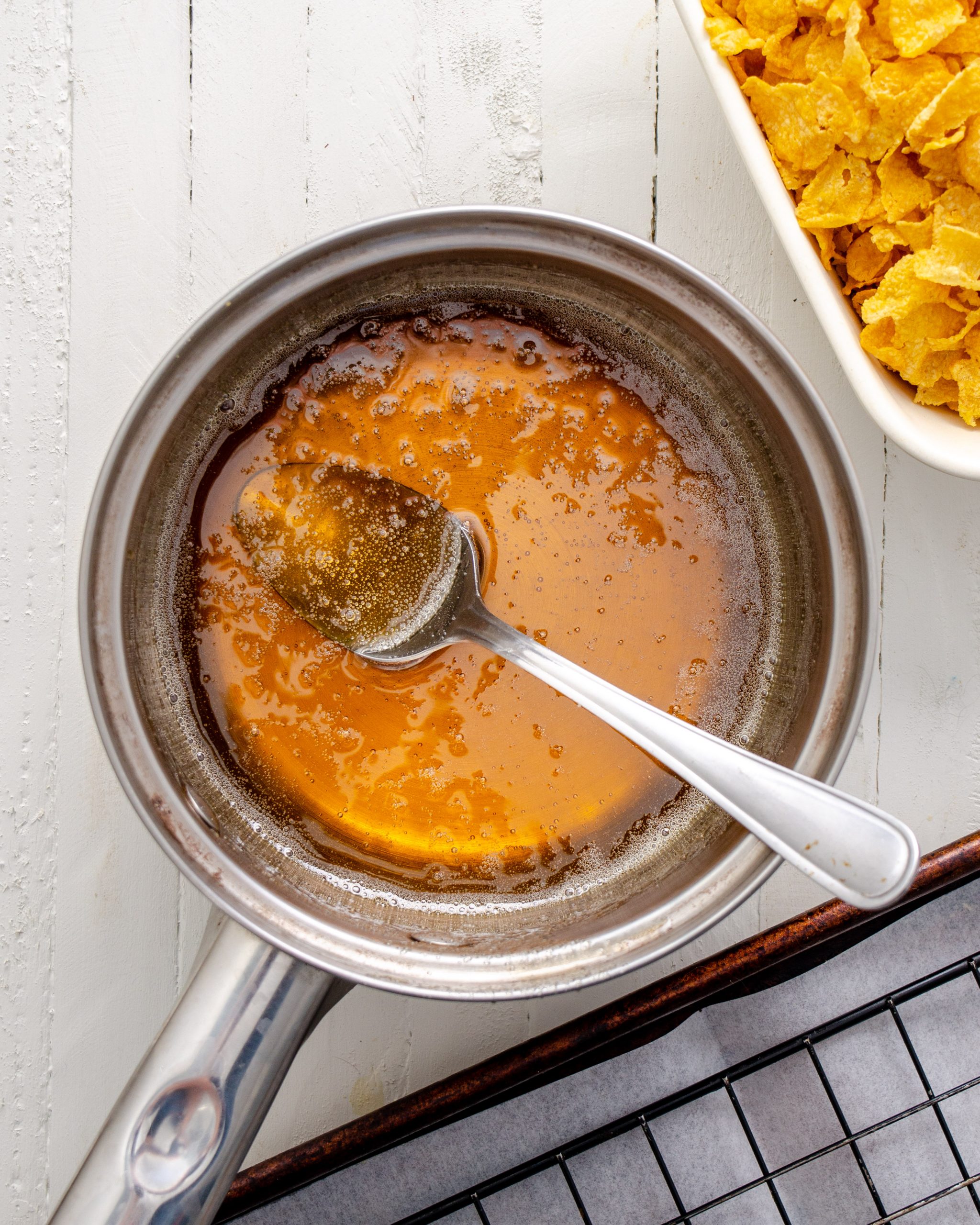 Cook the sugar and corn syrup in a cup over medium heat.