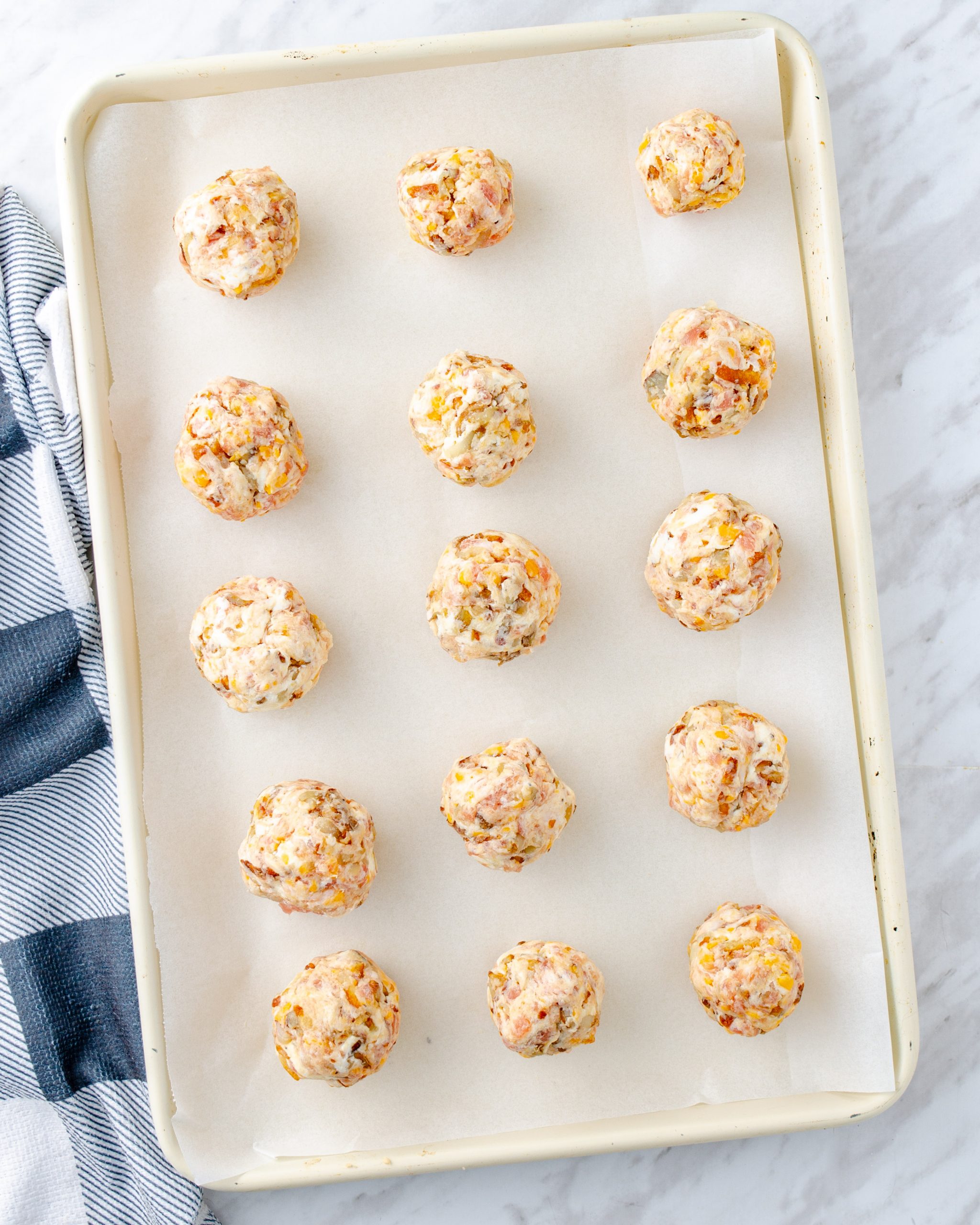 Form the mixture into 2-inch balls, and place them on the lined baking sheet. 