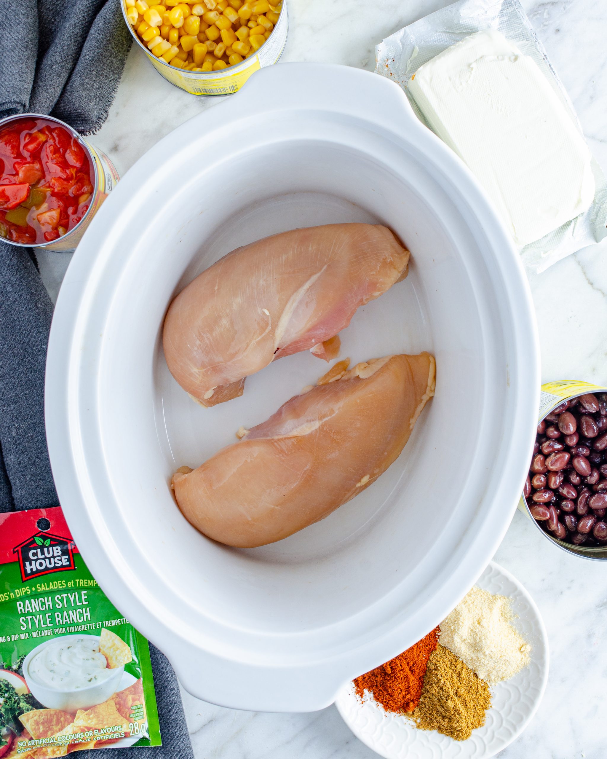  Layer the chicken in the bottom of the Crockpot. 
