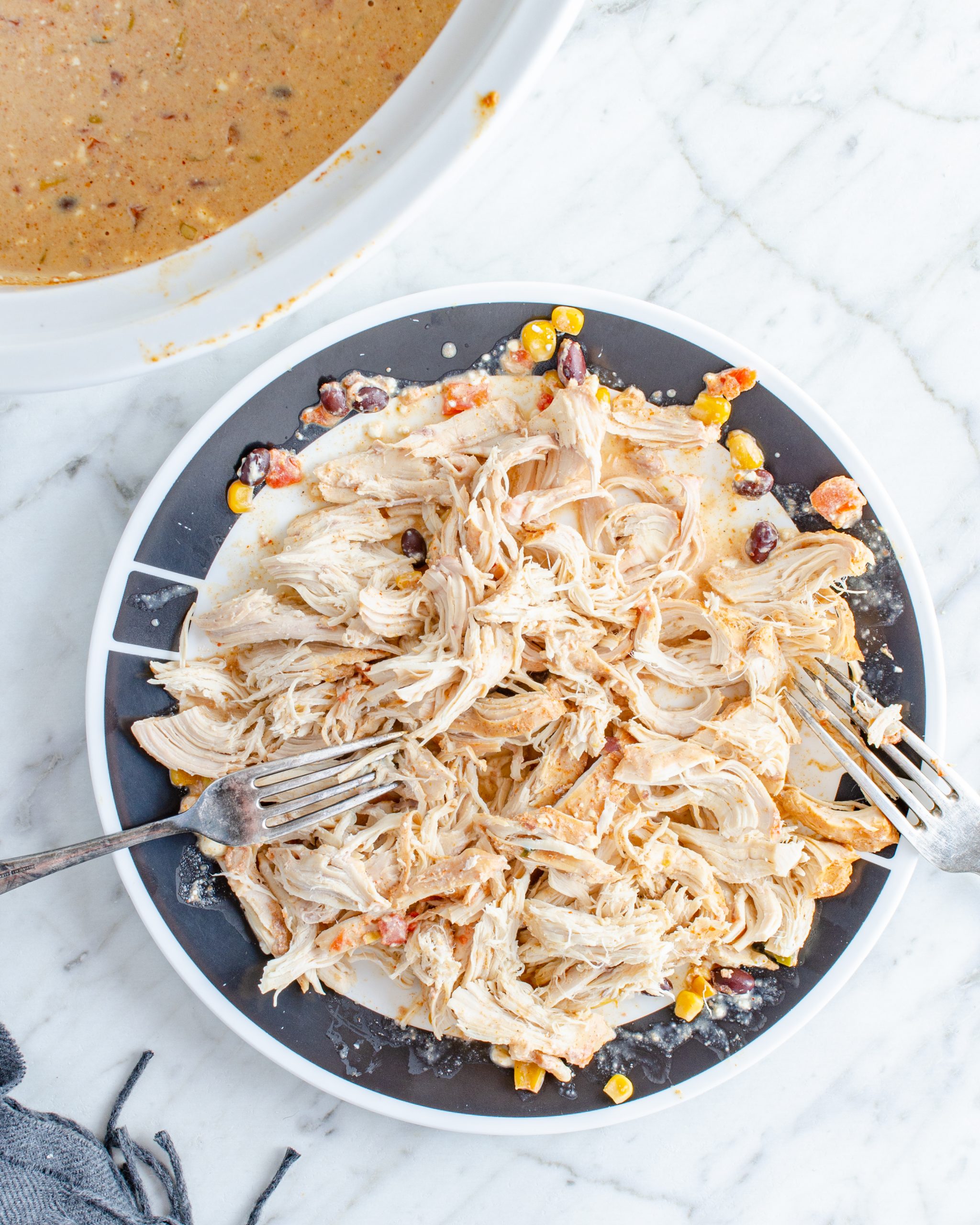 shred the chicken with two forks, and stir the contents to combine and mix well. 