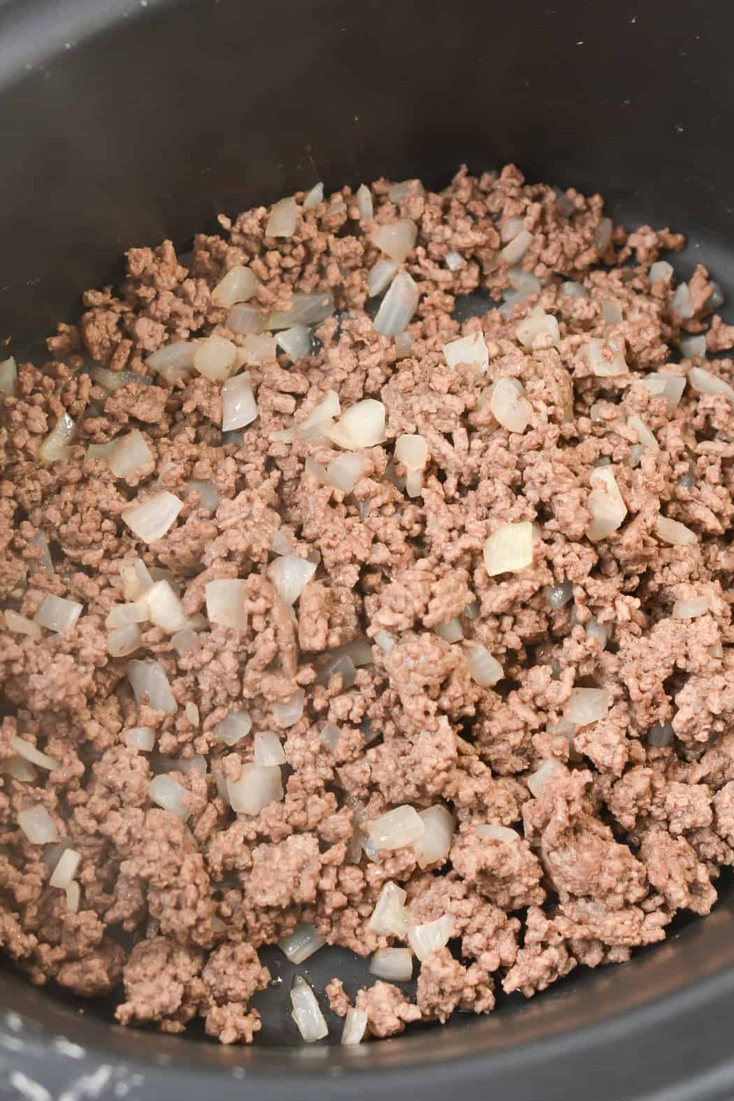 Place the meat mixture into the bottom of a crockpot.