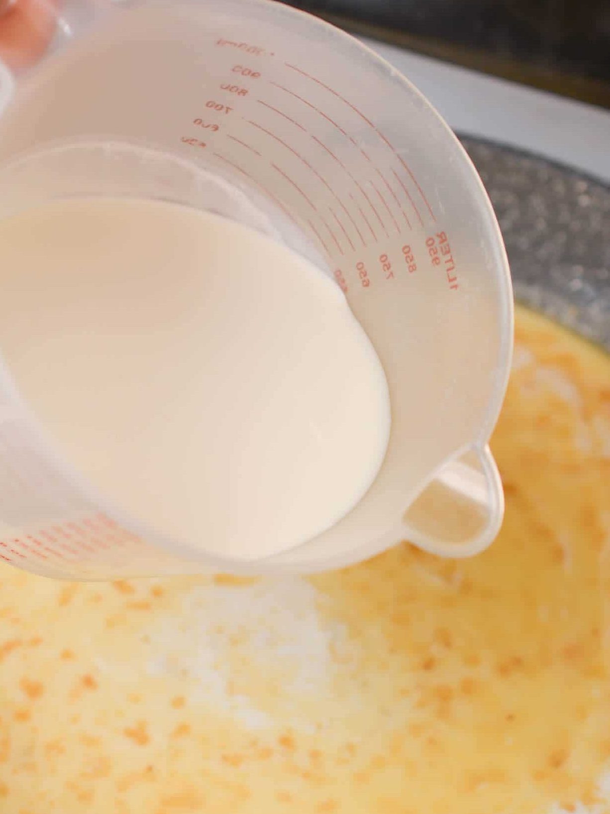 Pour in the milk and heavy whipping cream as well as salt and pepper to taste. 