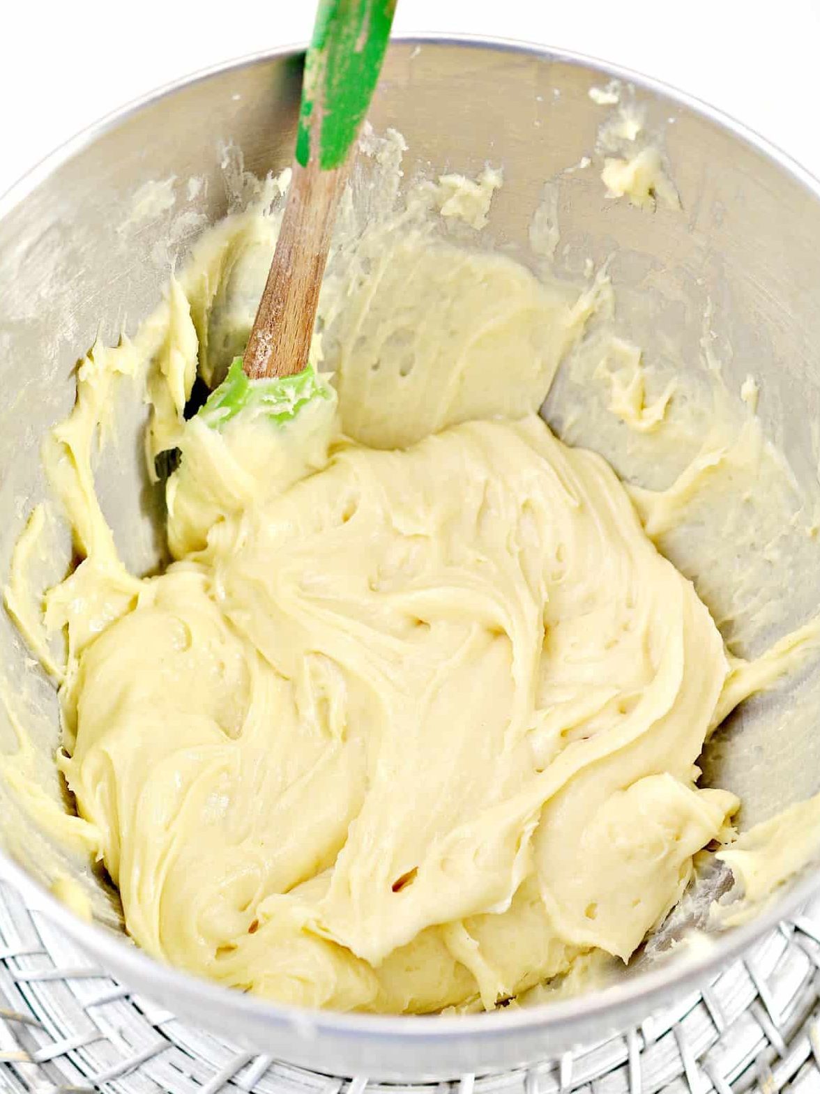 Mix the eggs into the dough one at a time. Be sure each egg is completely combined before adding another.
