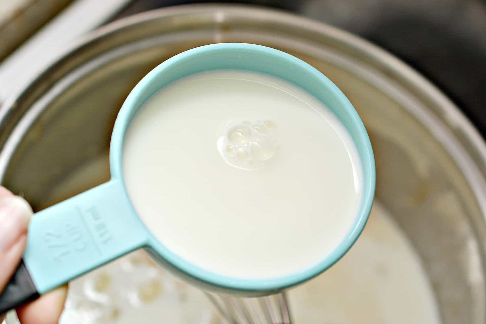 Whisk the milk and heavy whipping cream into the mixture in the saucepan