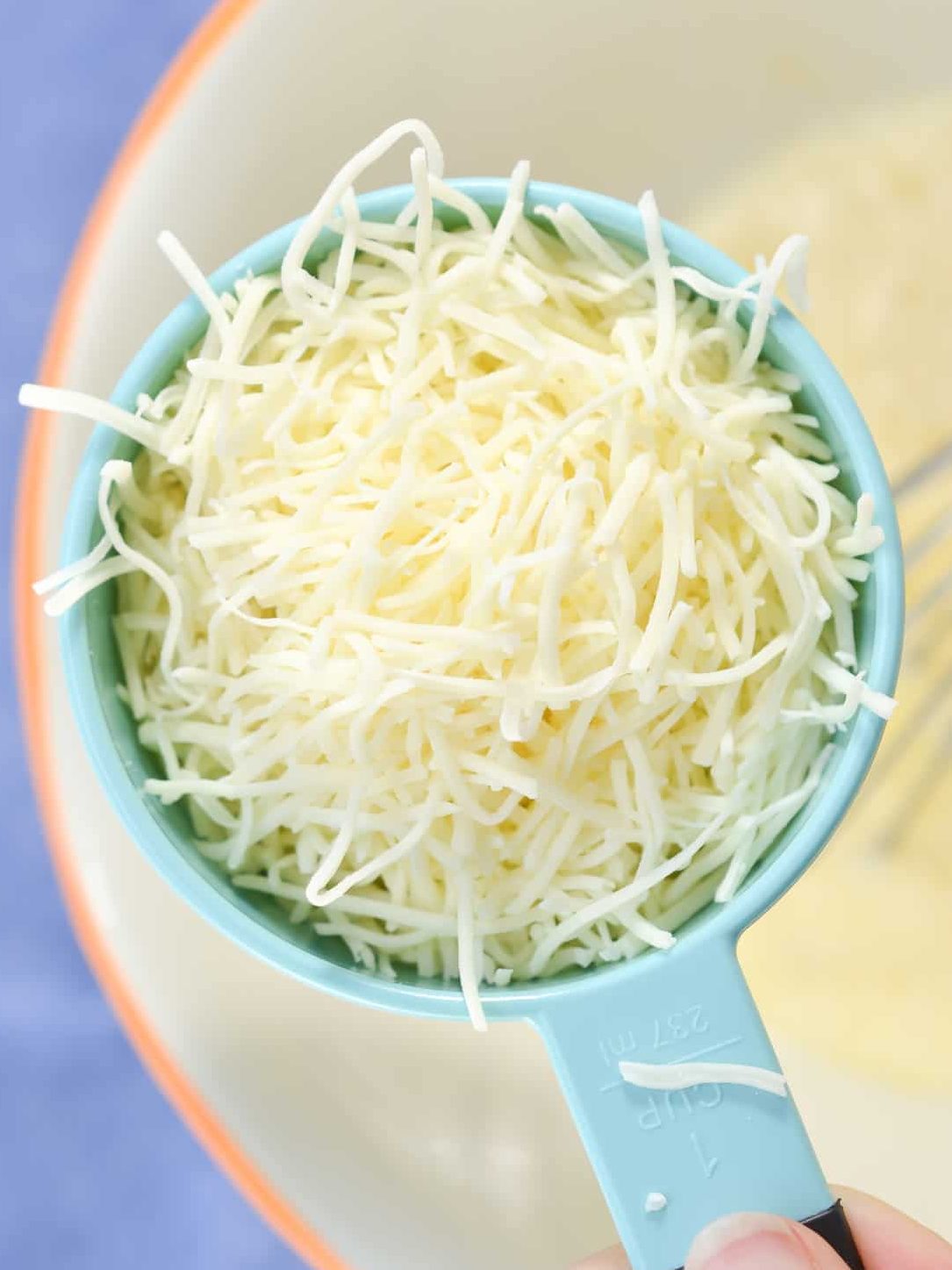 add 1 cup of each of the shredded cheeses.