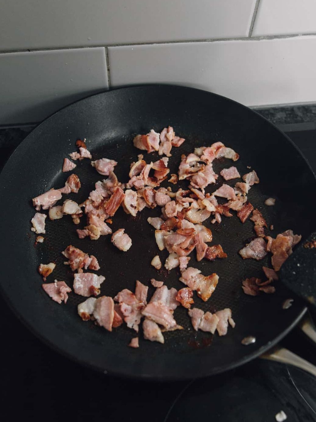  Cook bacon until crispy and set aside.