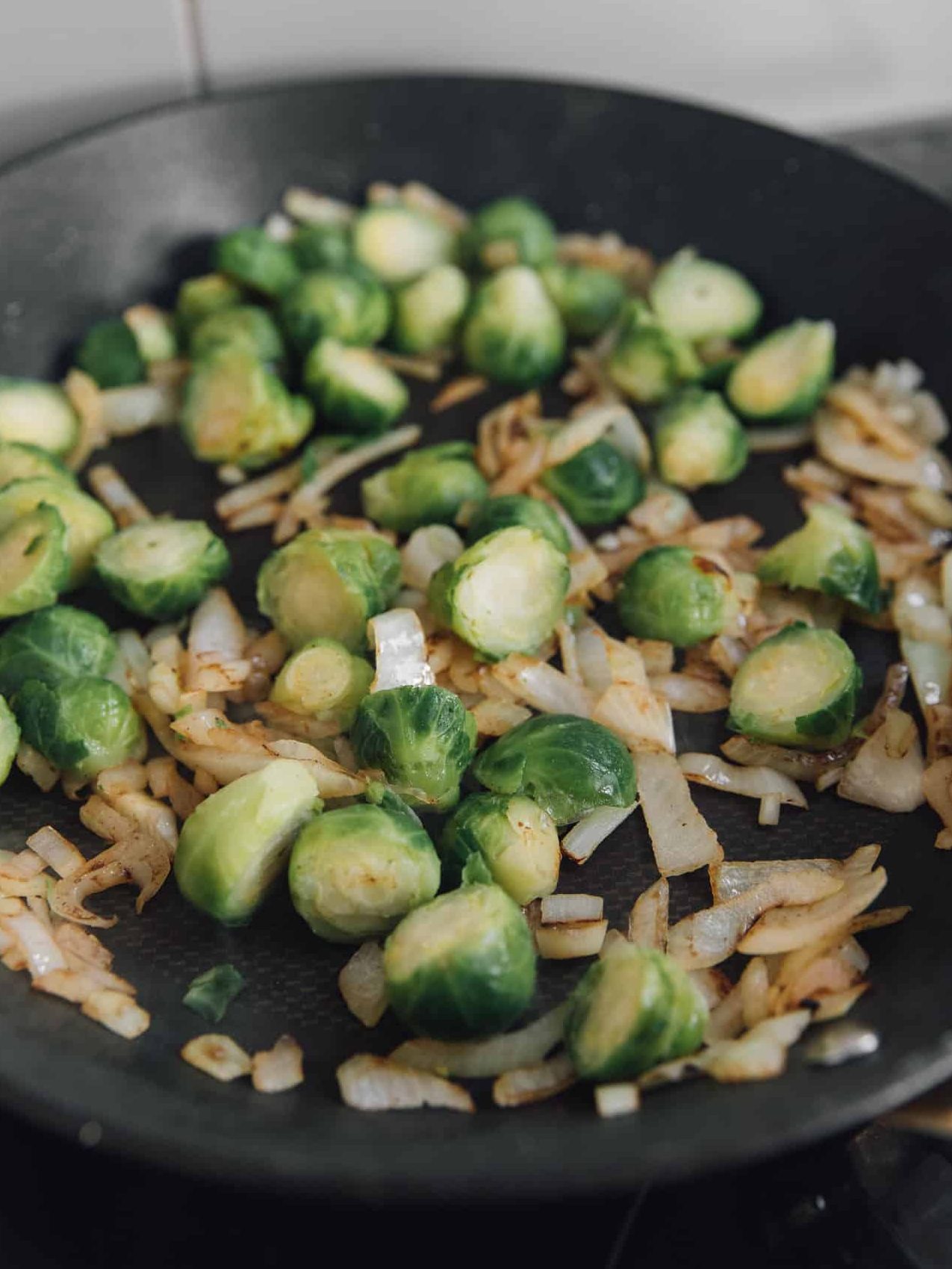 Cut the Brussel Spouts in half and add to the pan.