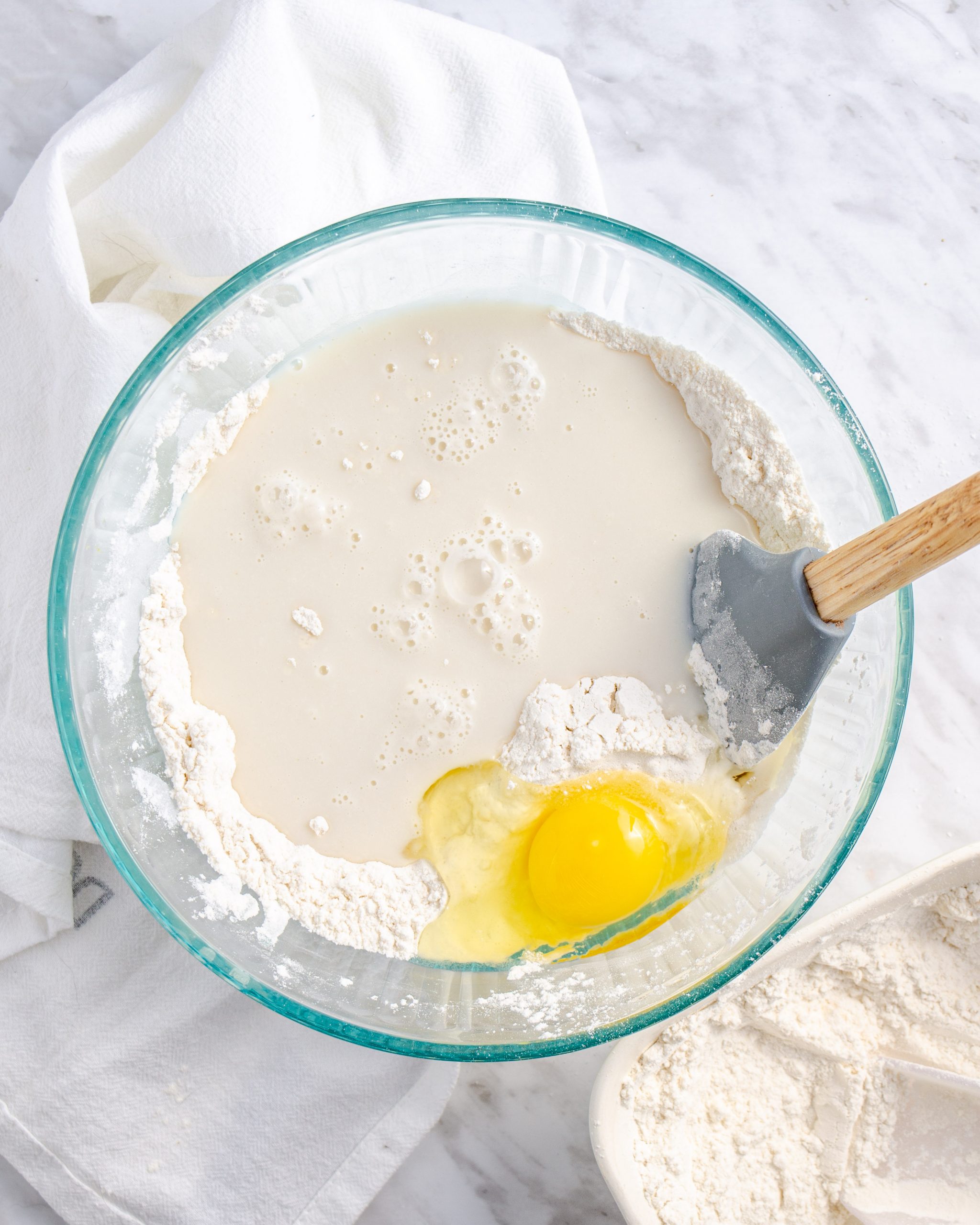 Add the egg and the yeast mixture to the flour mixture, and blend until a dough has formed.