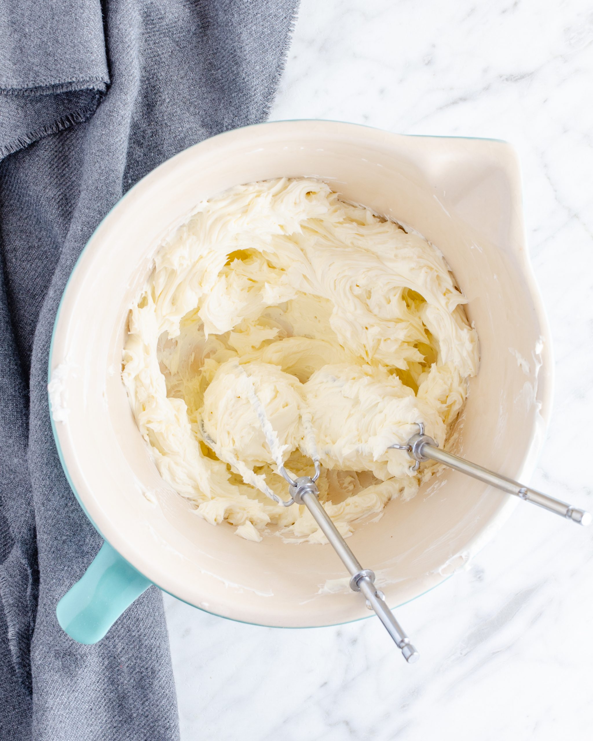 Place the cream cheese into a mixing bowl and blend until smooth. 