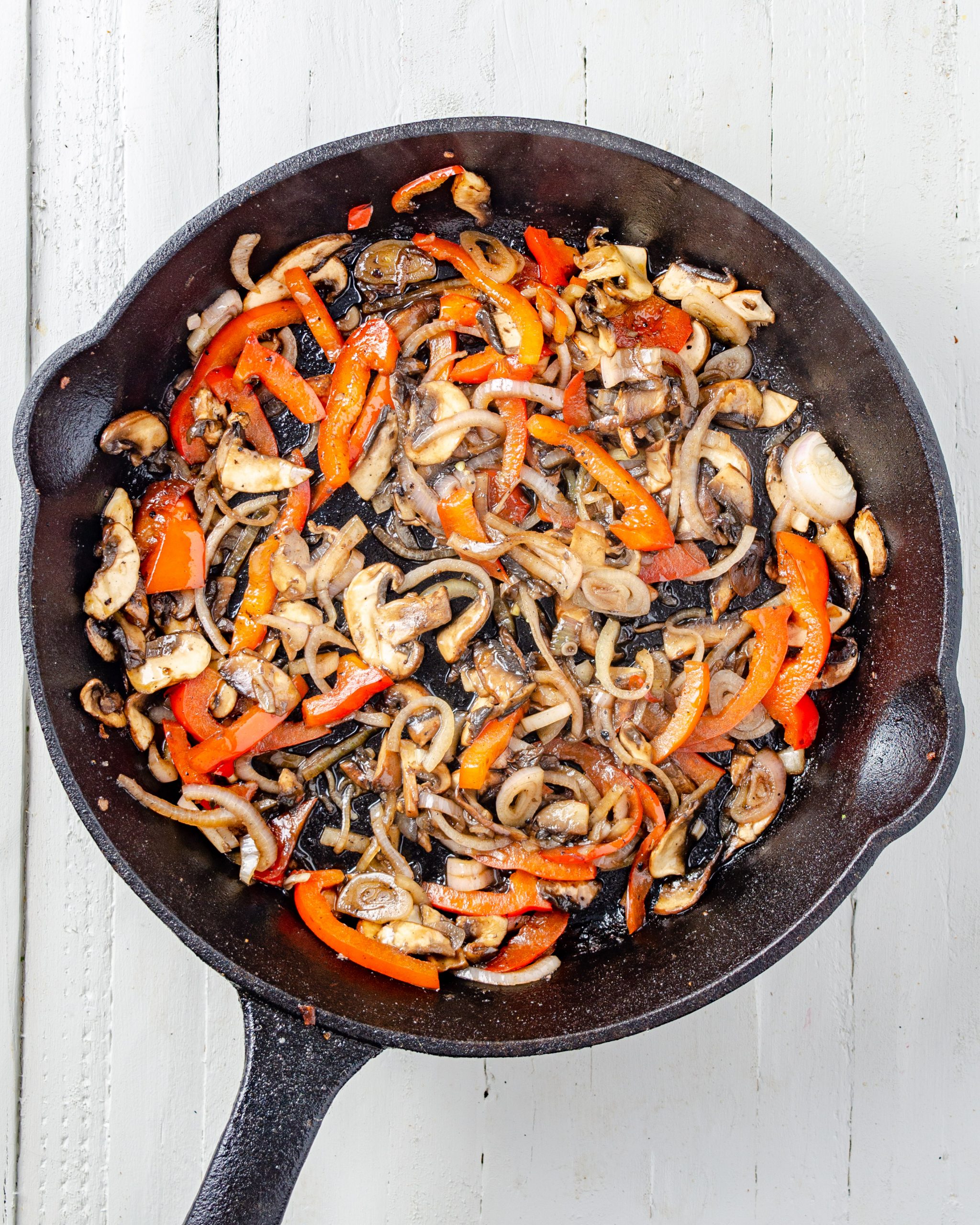 Add the mushrooms, red bell pepper, and onion to the skillet, and saute until becoming tender. 