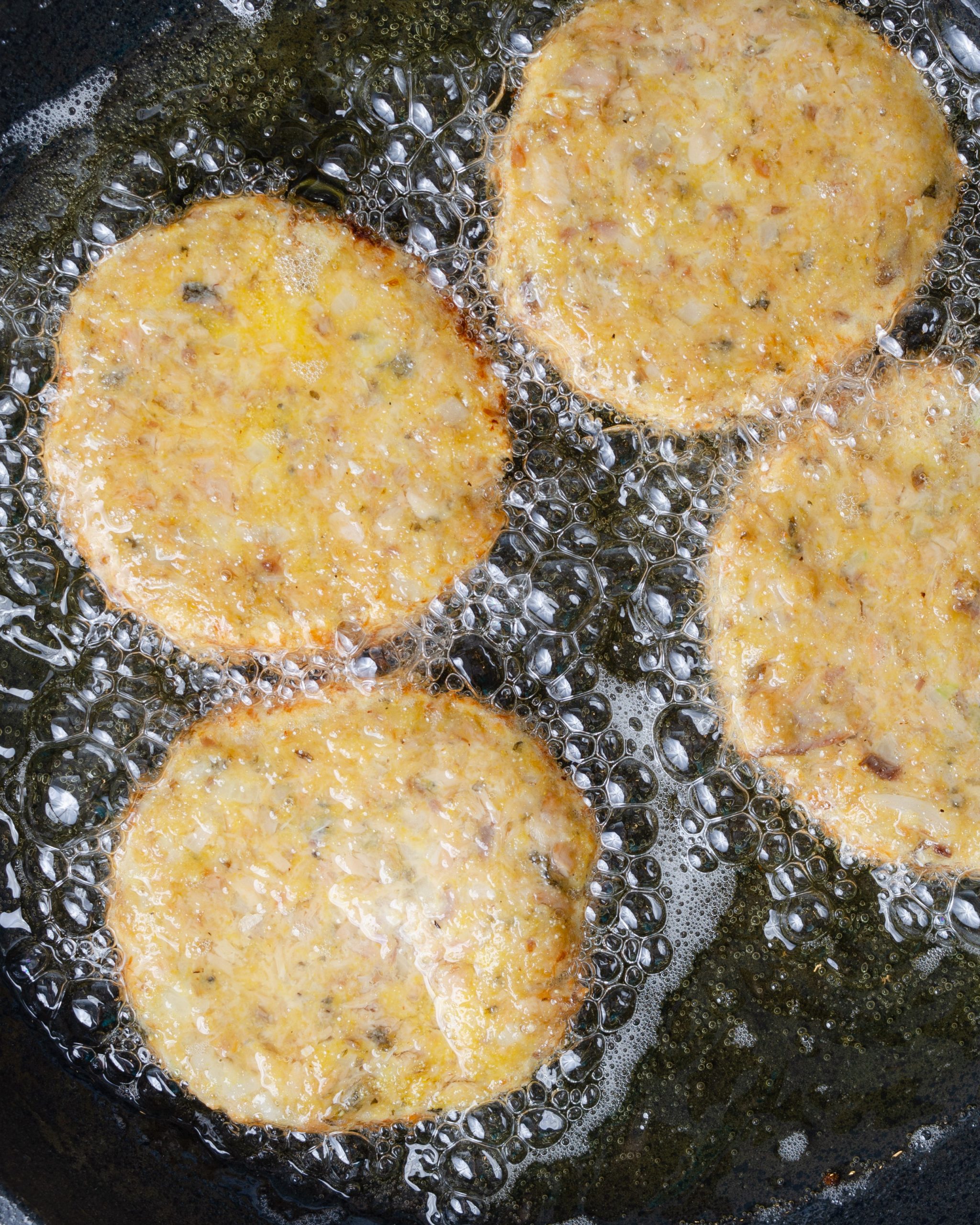 fry the salmon patties evenly on both sides until golden brown and cooked through.