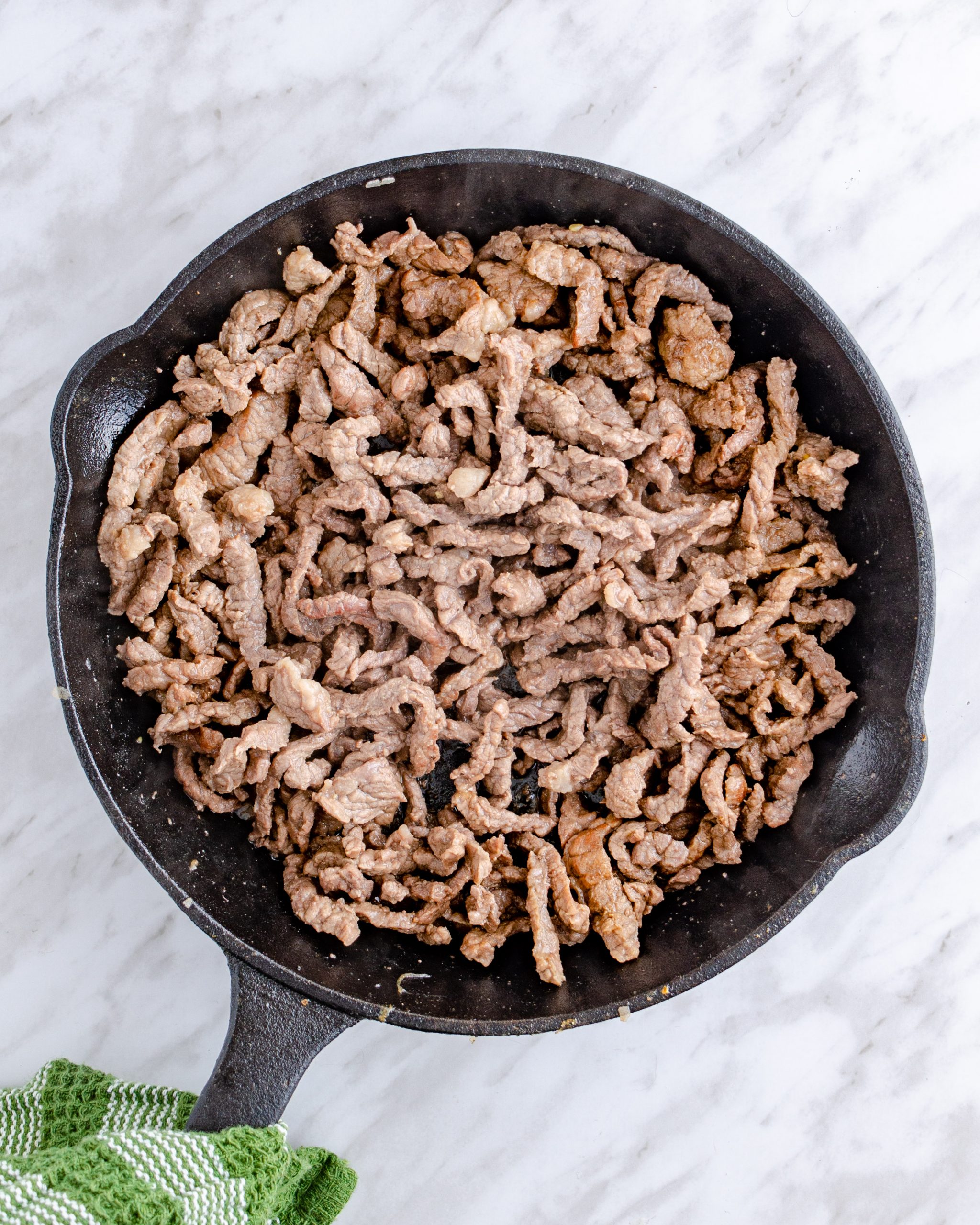 Cook the cheesesteak meat until browned and set aside.
