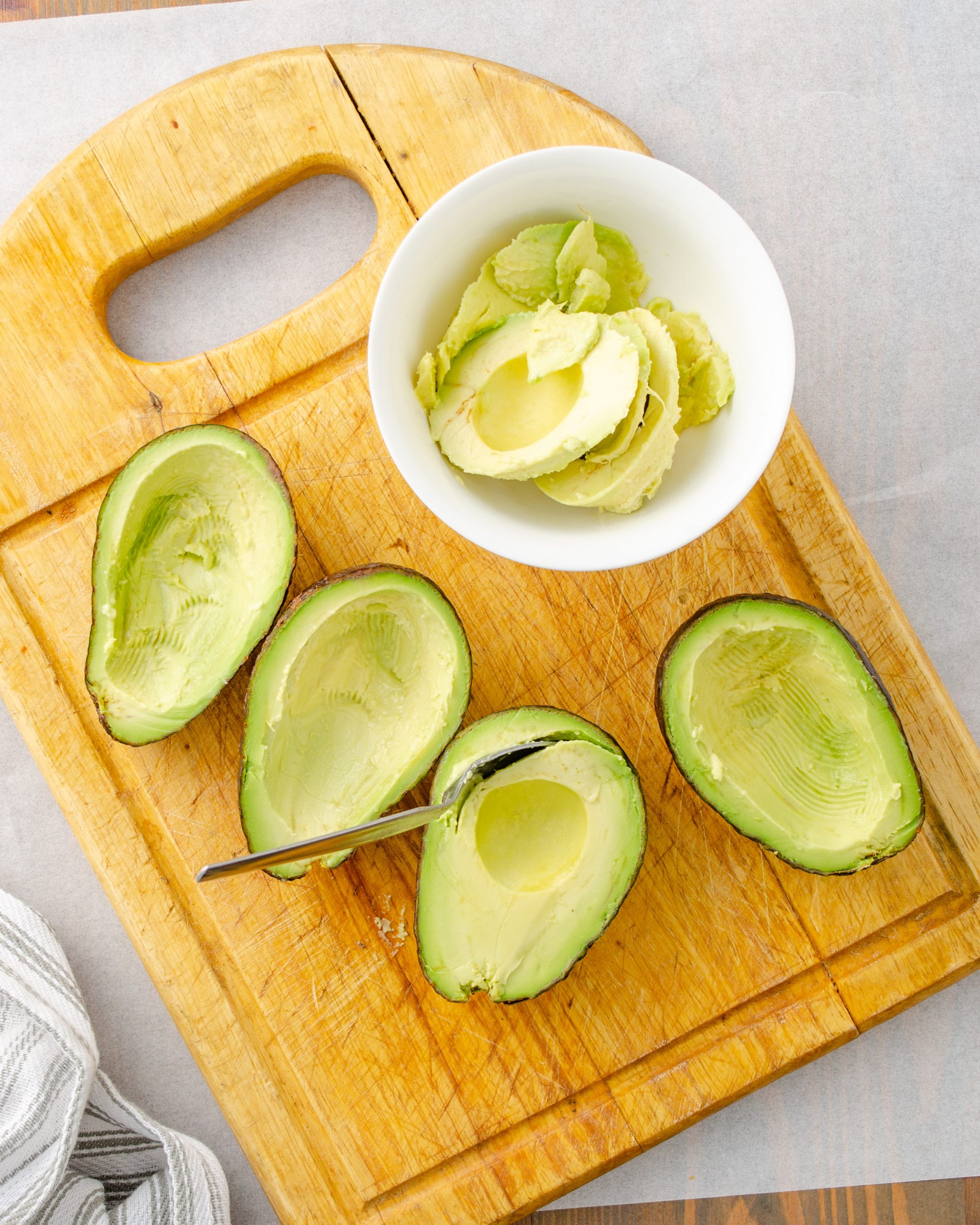 Scoop out the flesh from the inside of the avocados.