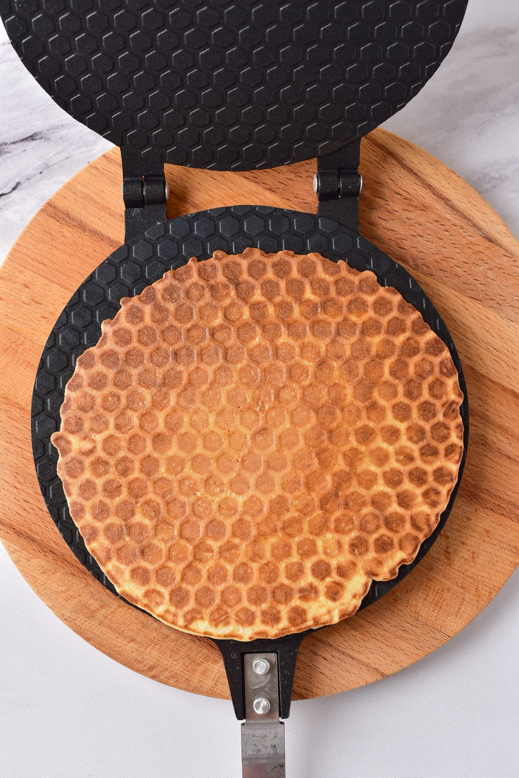 Spread a ¼ cup of the batter into a heated waffle iron, and cook on medium until slightly browned.