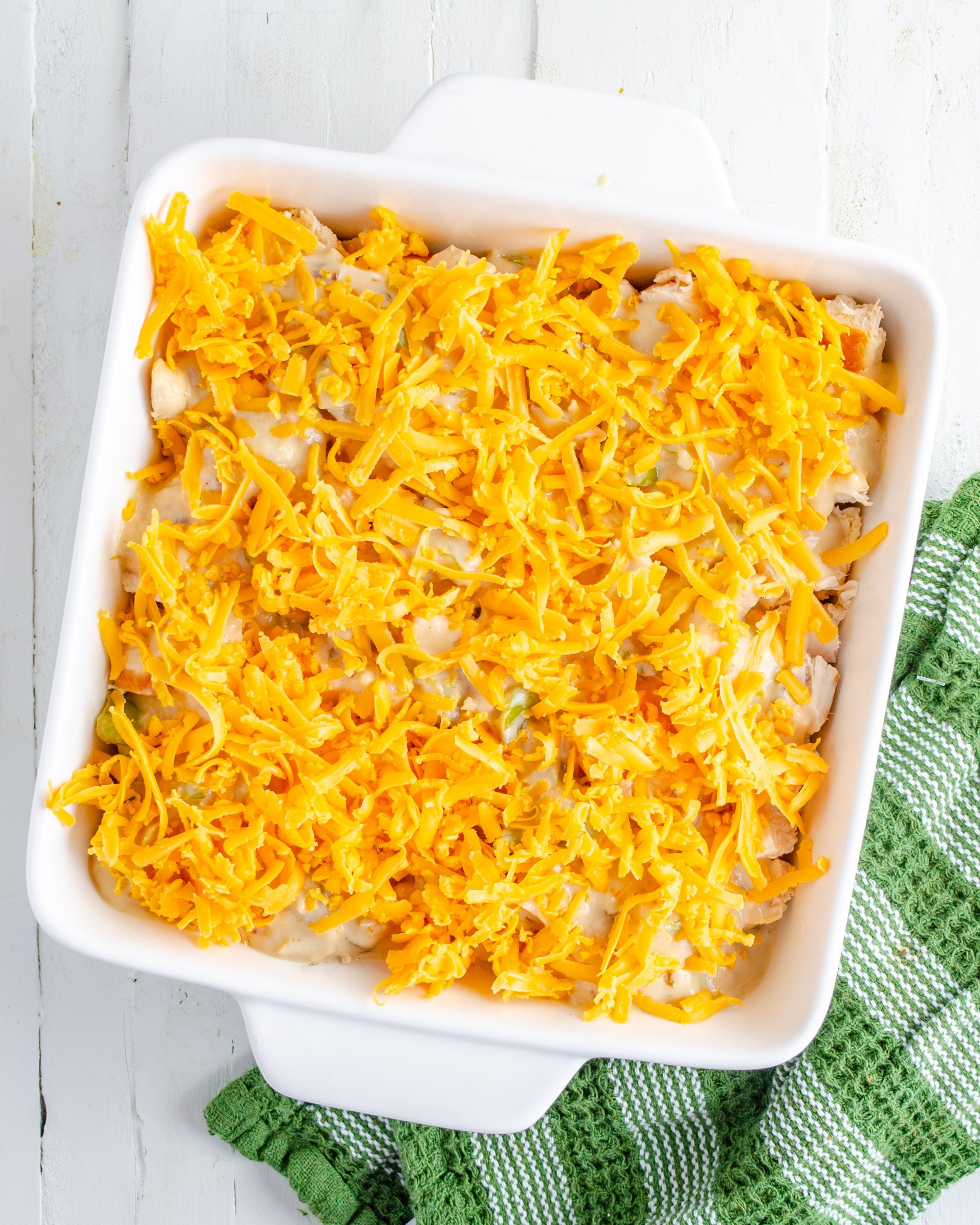 Layer the cheddar cheese on top. 