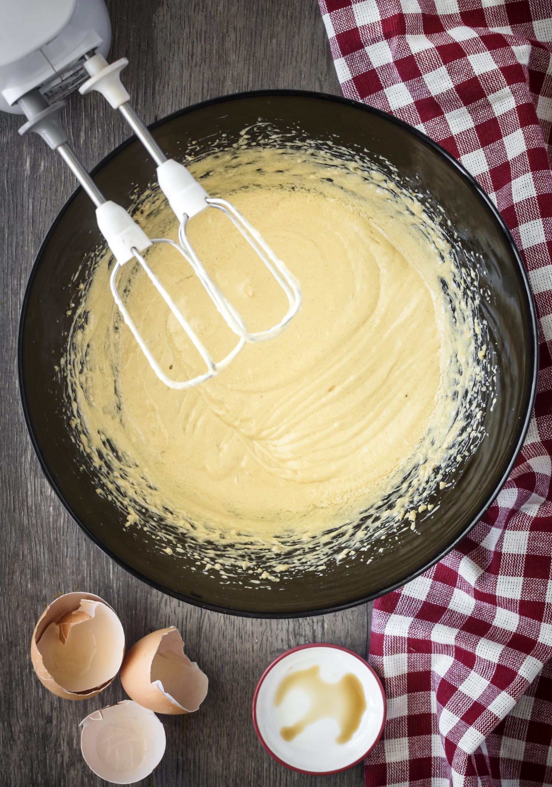 Add the vanilla extract and eggs to the mixing bowl, and blend until smooth. 