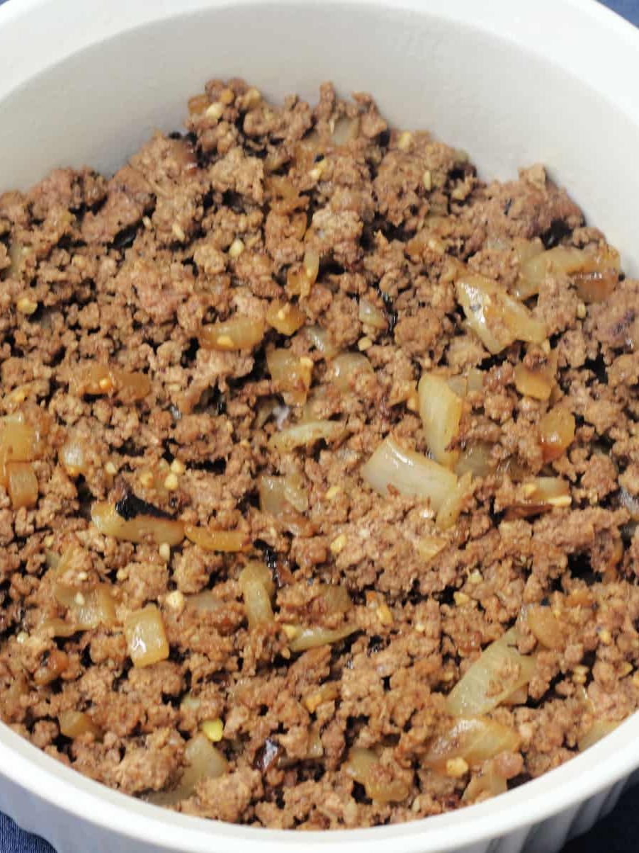 Pour the beef mixture into the baking dish.
