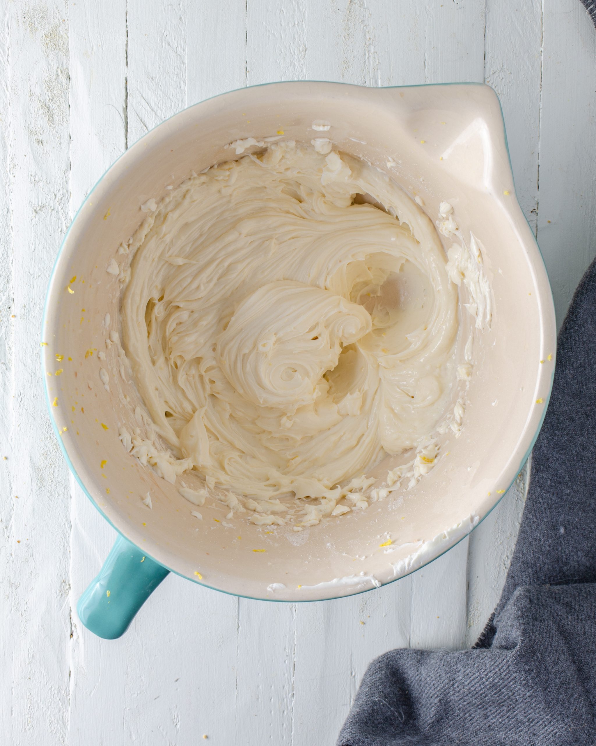 Blend together the cream cheese, powdered sugar, lemon zest, and vanilla in a mixing bowl until light and creamy. Chill for 30 minutes. 