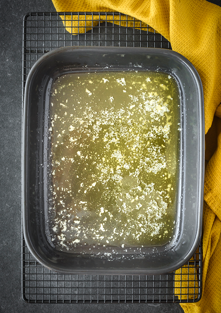 Spread the melted butter into the bottom of a 9x9 baking dish. 