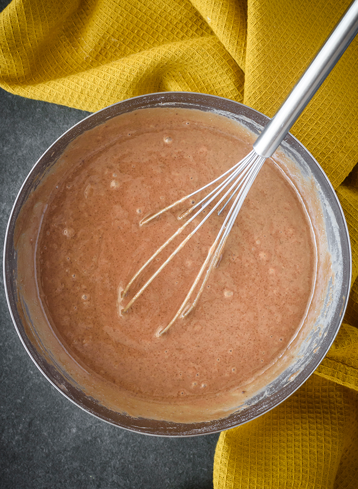 In a bowl, stir together the baking powder, flour, milk, granulated sugar, vanilla, and 1 ½ Tbsp of cocoa powder. 