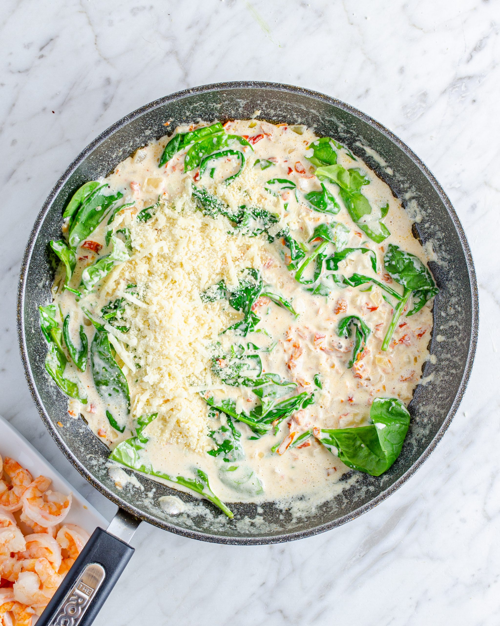 stir in the Parmesan cheese and cook until wilted.