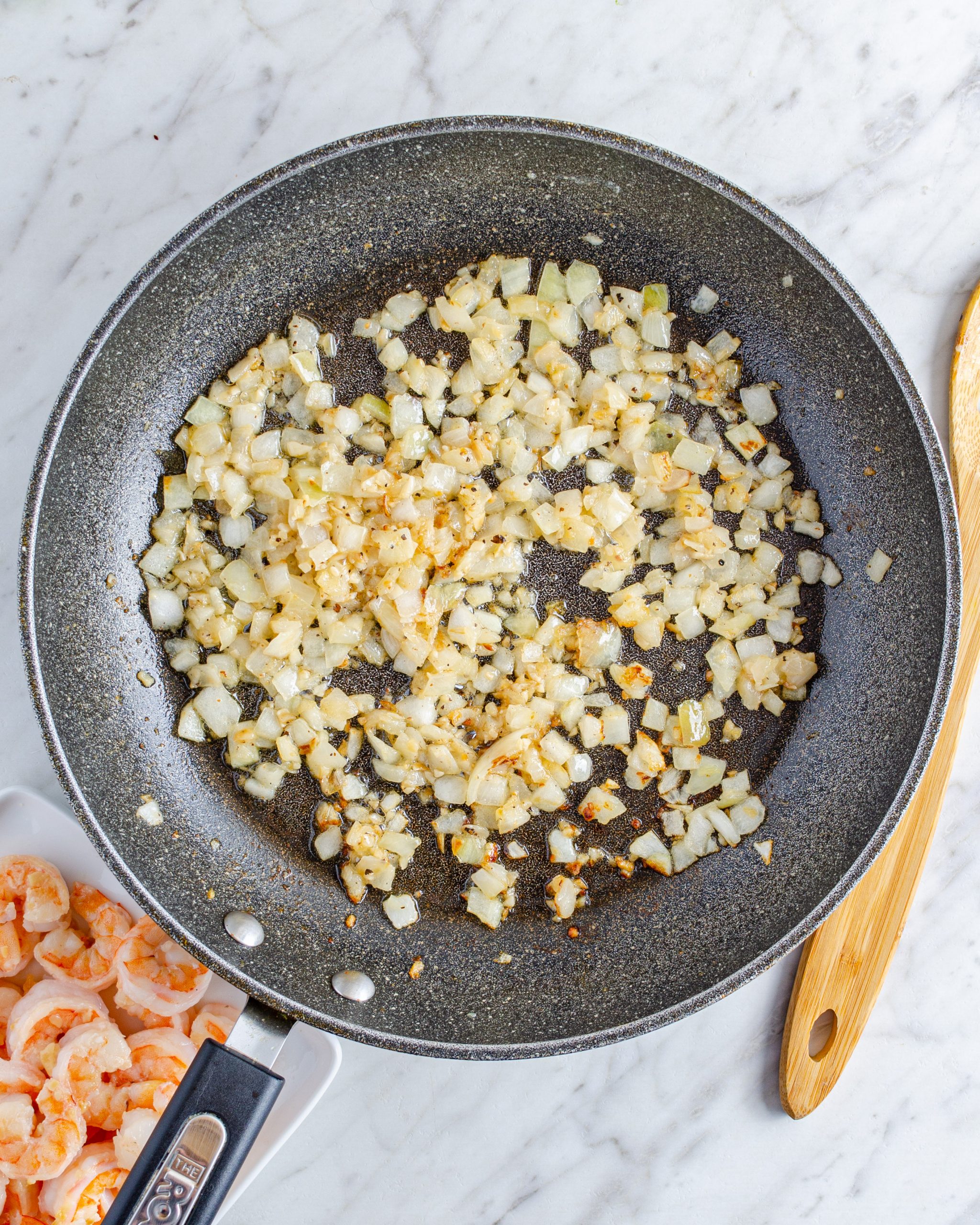 Reduce the heat to medium, and add the onions into the same skillet with the leftover butter, saute until the onions have softened.