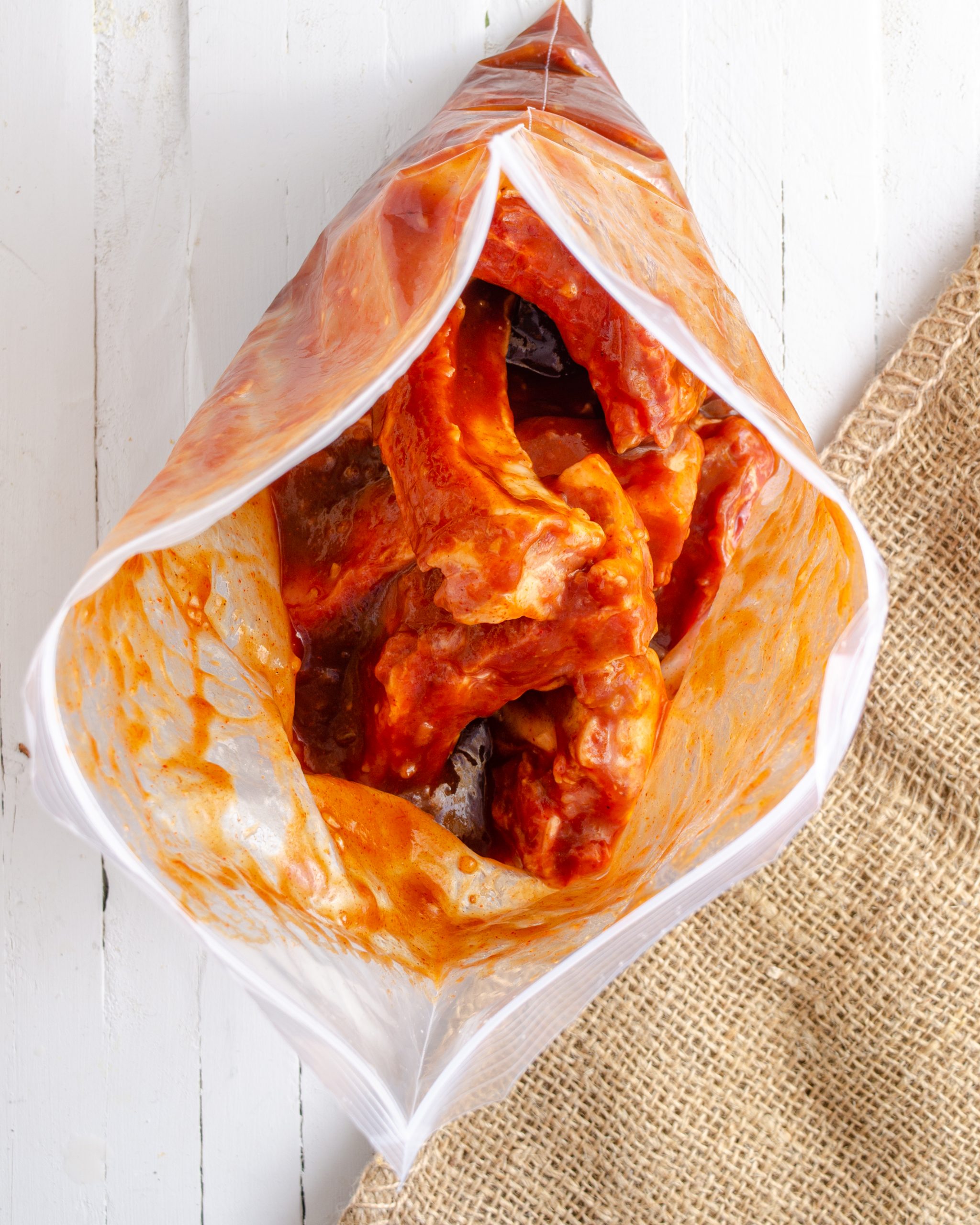 Add the ribs to the Ziploc bag, close it, and toss to coat the ribs in the sauce. 