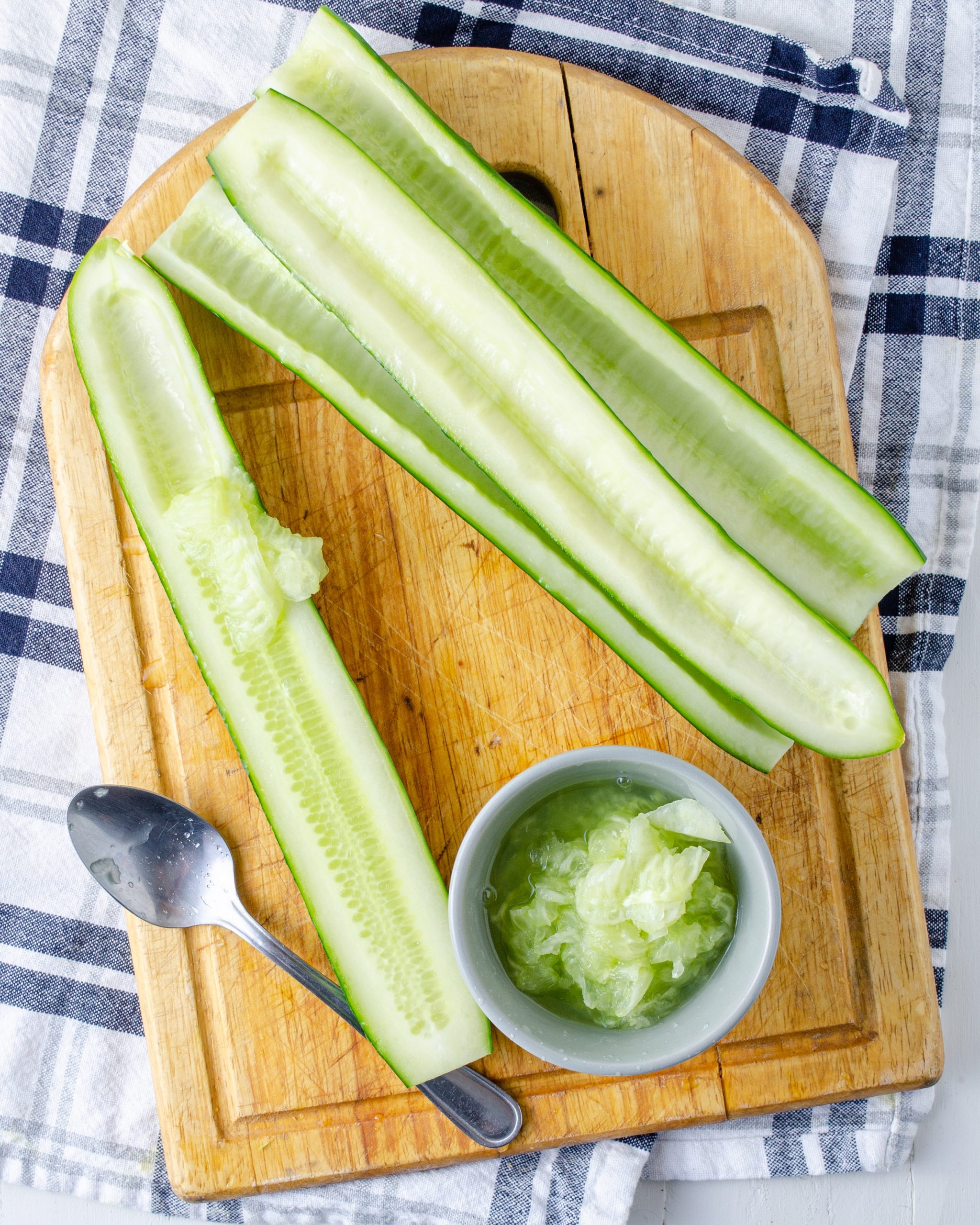 Cut the cucumbers in half lengthwise. Deseed the cucumbers.