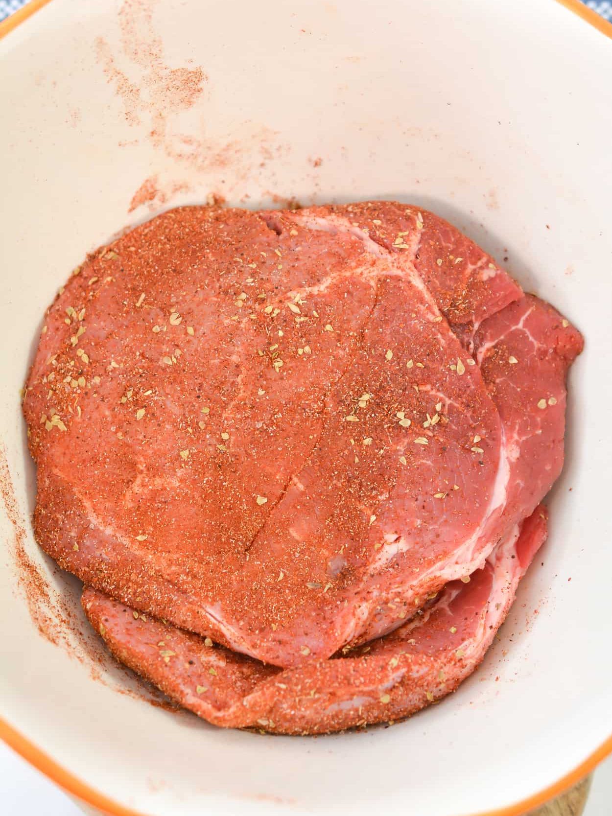 Season the steak with the spice mixture.
