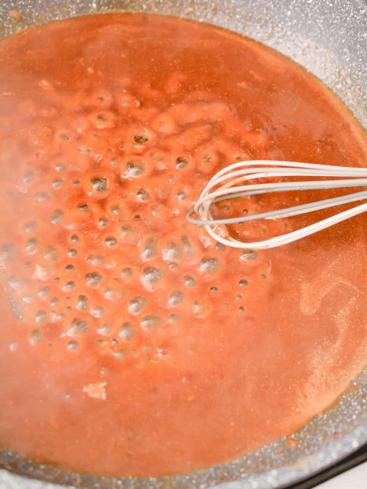 Mix the gravy packet with the water, and start cooking in a skillet over medium-low heat.