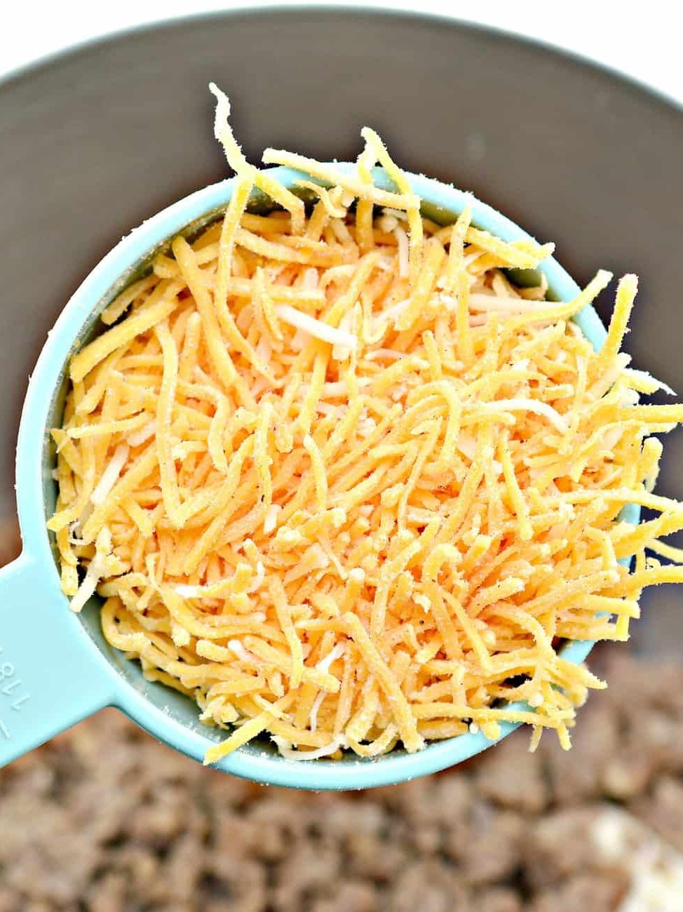 add shredded cheese of your choosing as well as pepper to taste. Stir to combine completely.