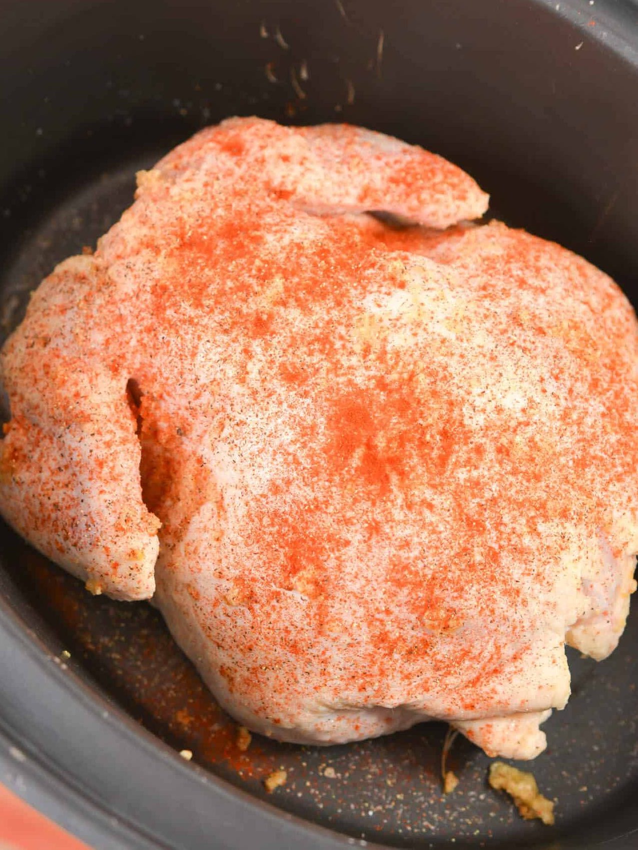Add paprika, pepper and salt to taste to the outside of the chicken.