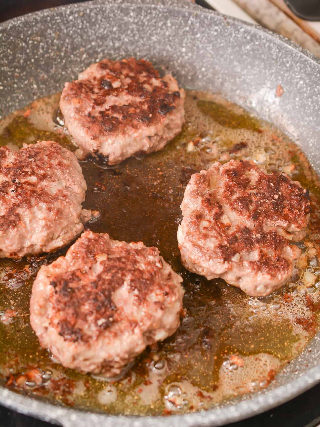 Add the patties to the heated skillet and saute for a few minutes on each side until evenly seared. Remove and set aside.