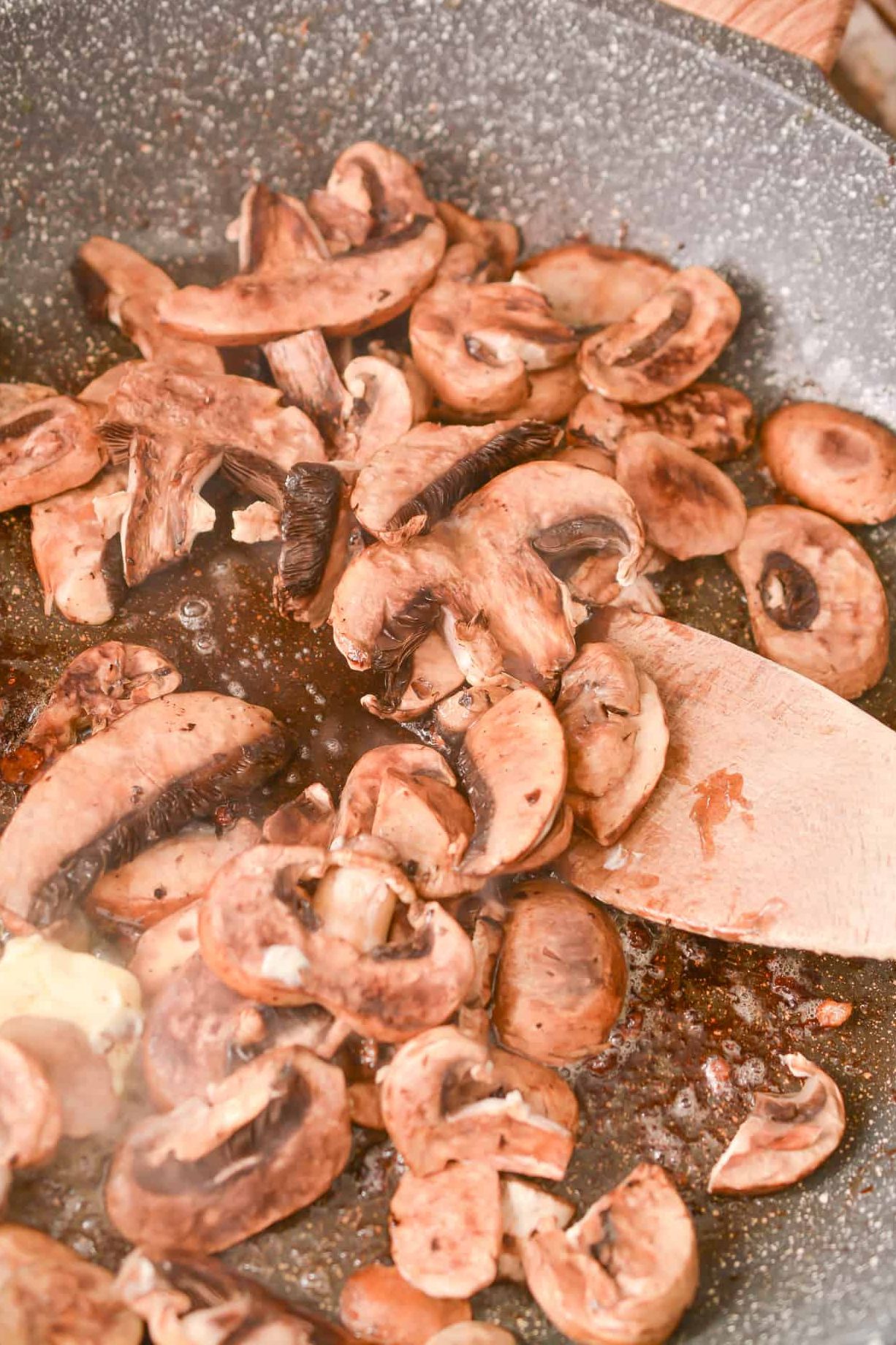 add 8 oz of sliced mushrooms, and saute until the mushrooms begin to soften.