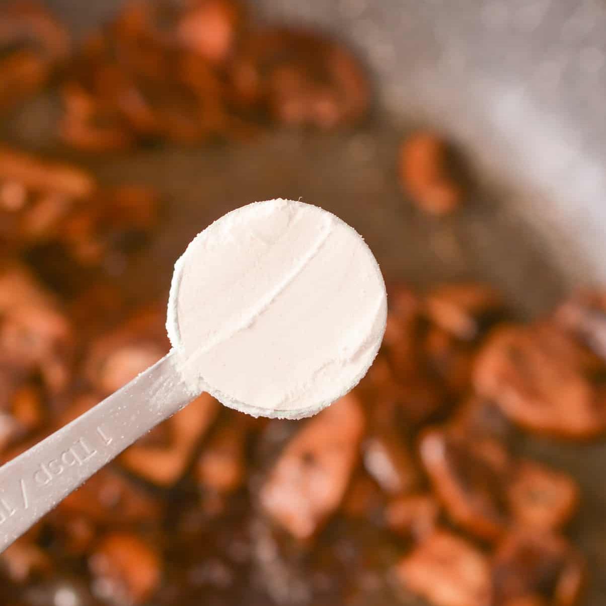 Sprinkle 2 tbsp of flour over the mushrooms, and stir to combine well.