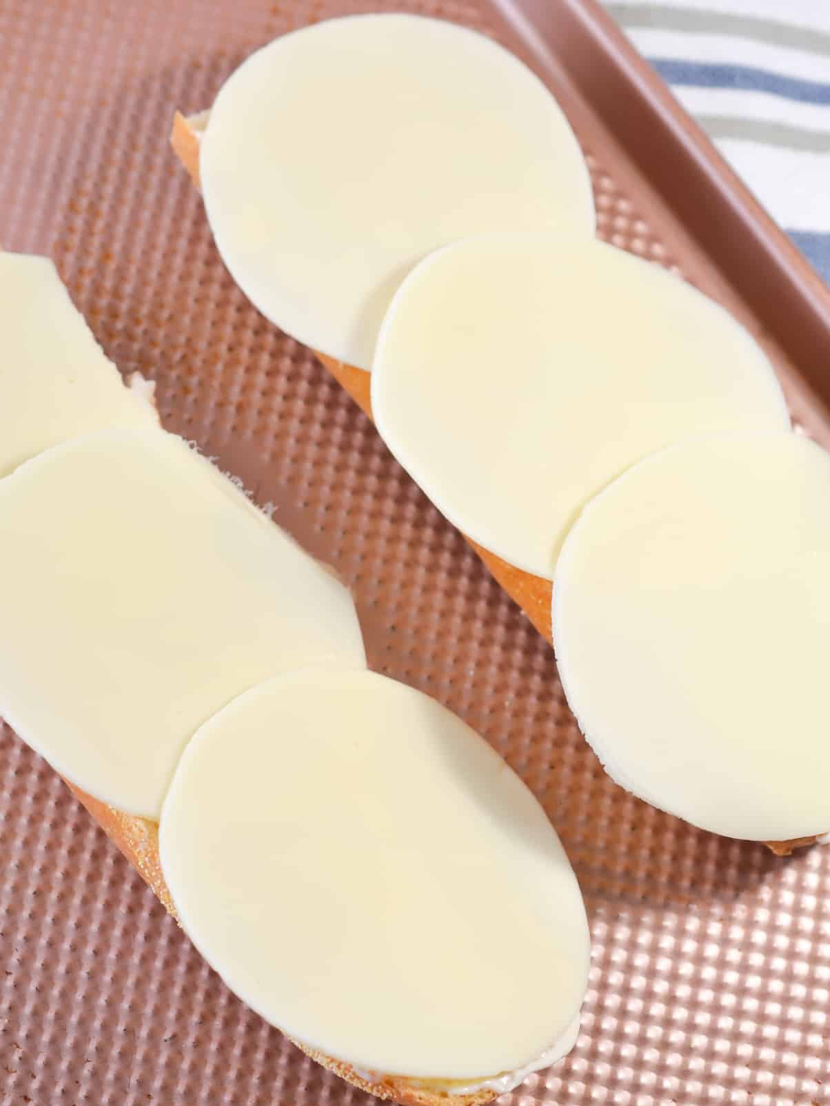 Layer half of the cheese slices on the bread.