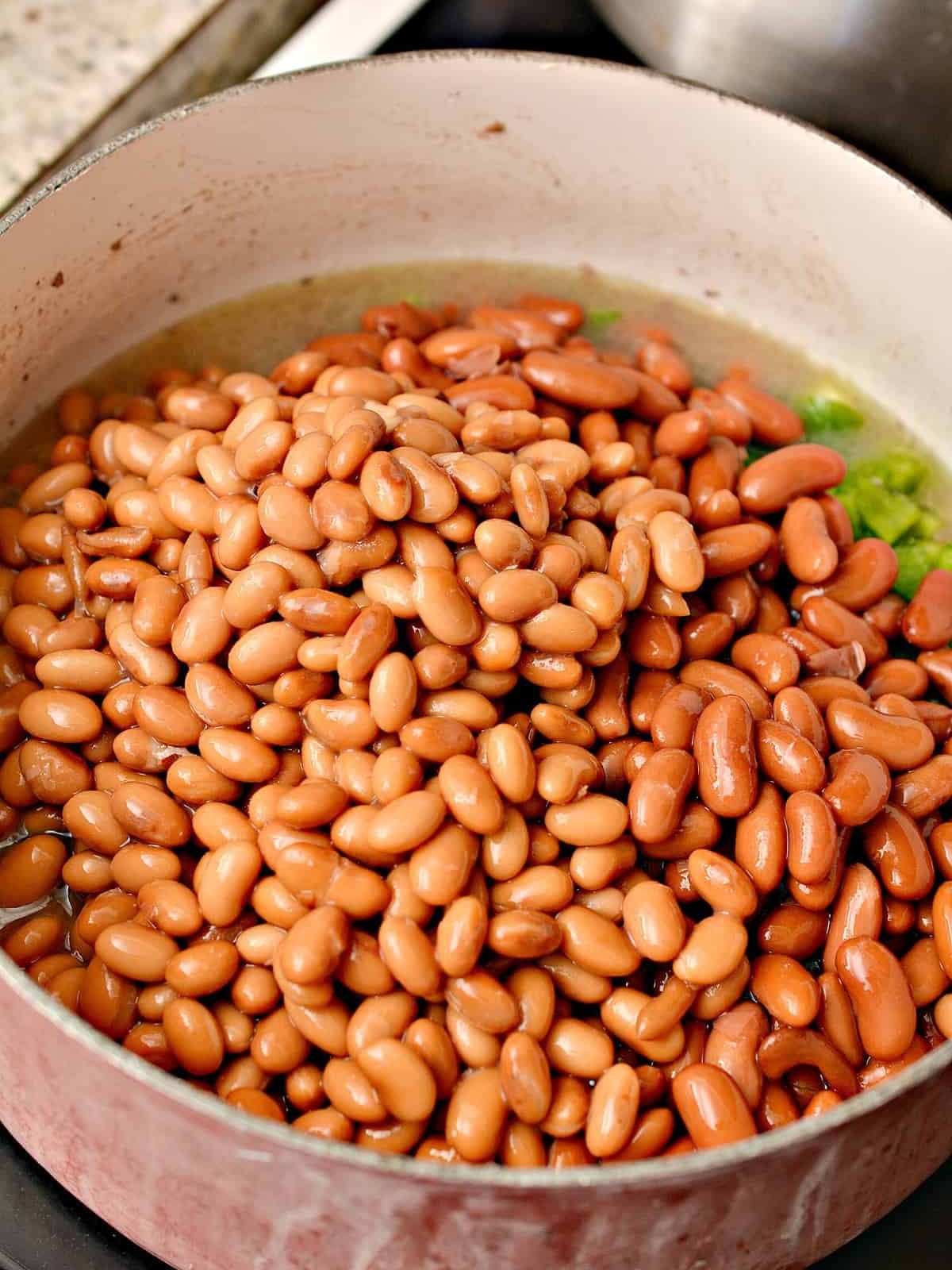 Add 2 cans of pinto beans not drained and 2 cans of kidney beans not drained.