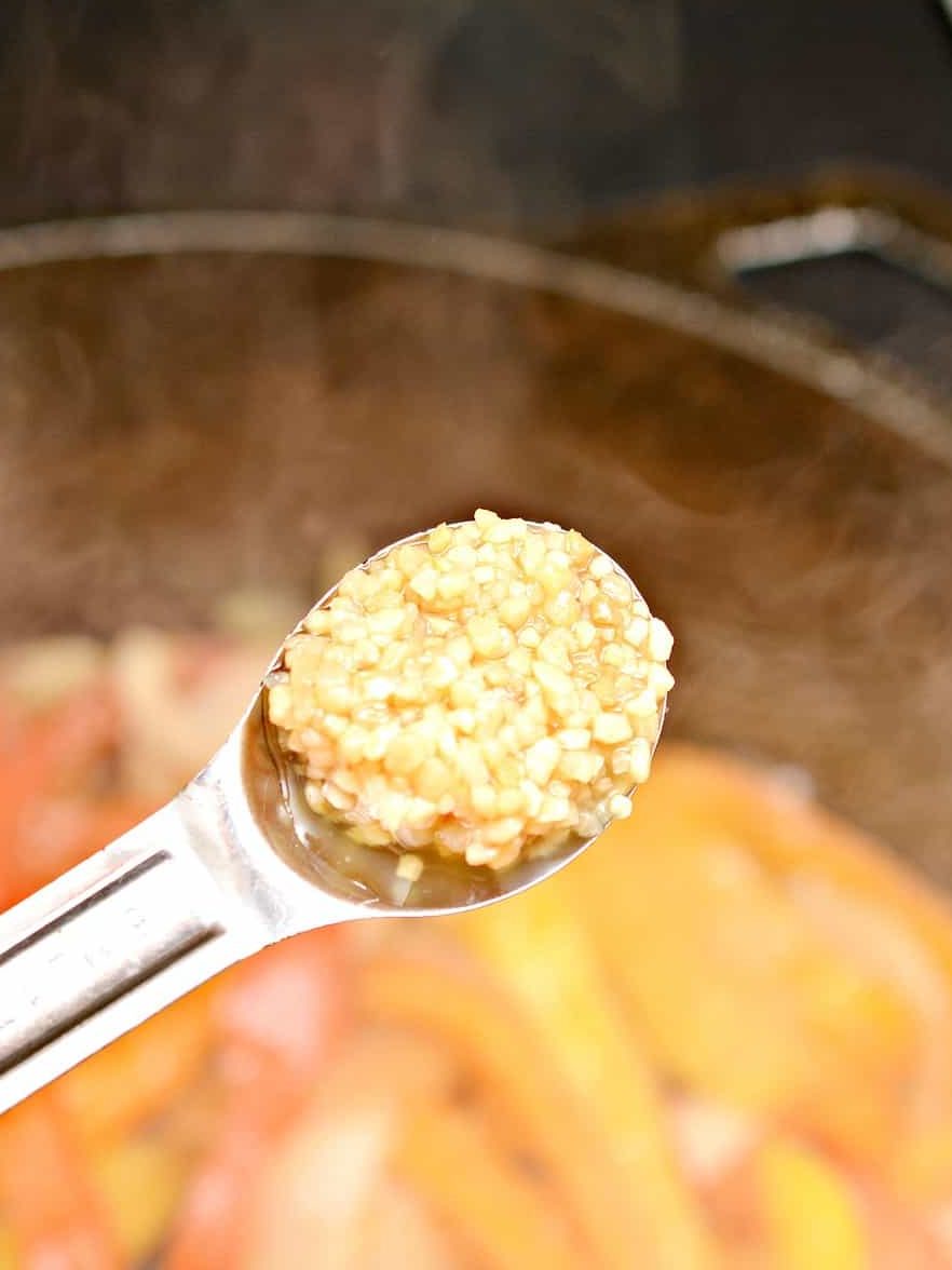 Place the minced garlic into the pan with the vegetables, and saute for 30 seconds.