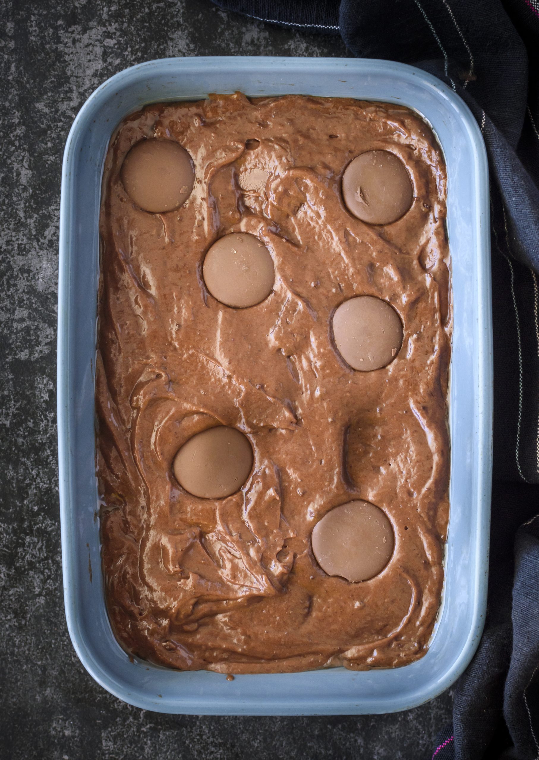Spread the batter into the greased baking dish. 