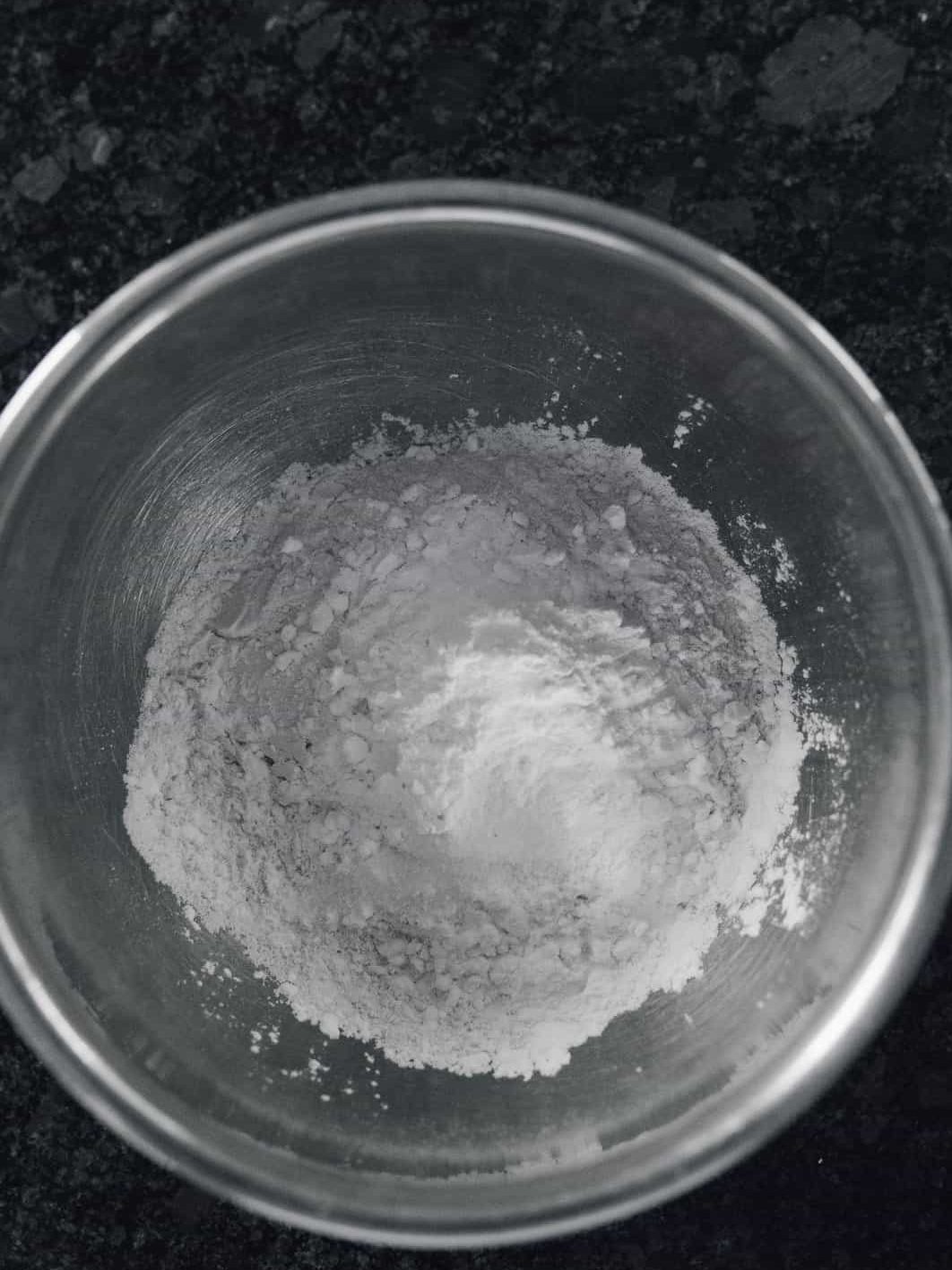Grab a large mixing bowl, sift together the flour, cornstarch, baking soda, baking powder, and salt