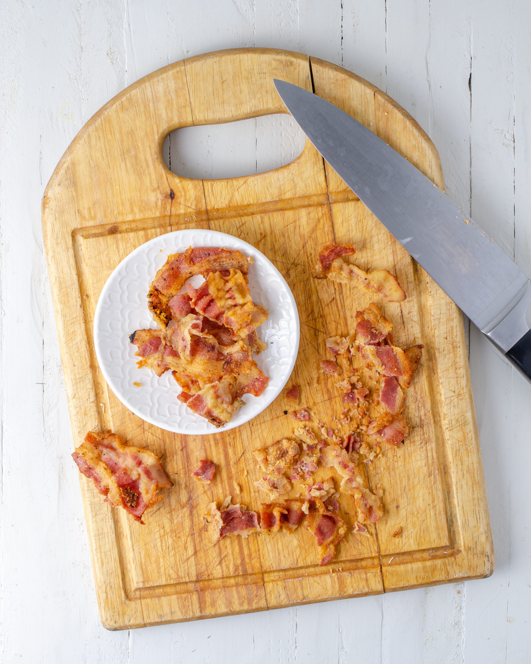 Fry the bacon until crispy, then crumble and set aside.