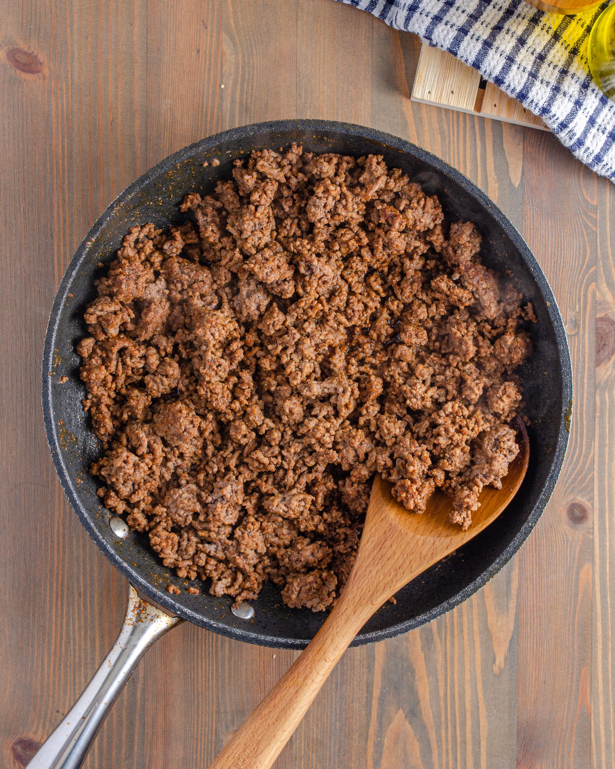Add the ground beef to a skillet over medium-high heat on the stove. Saute until browned completely. Drain any excess grease. 