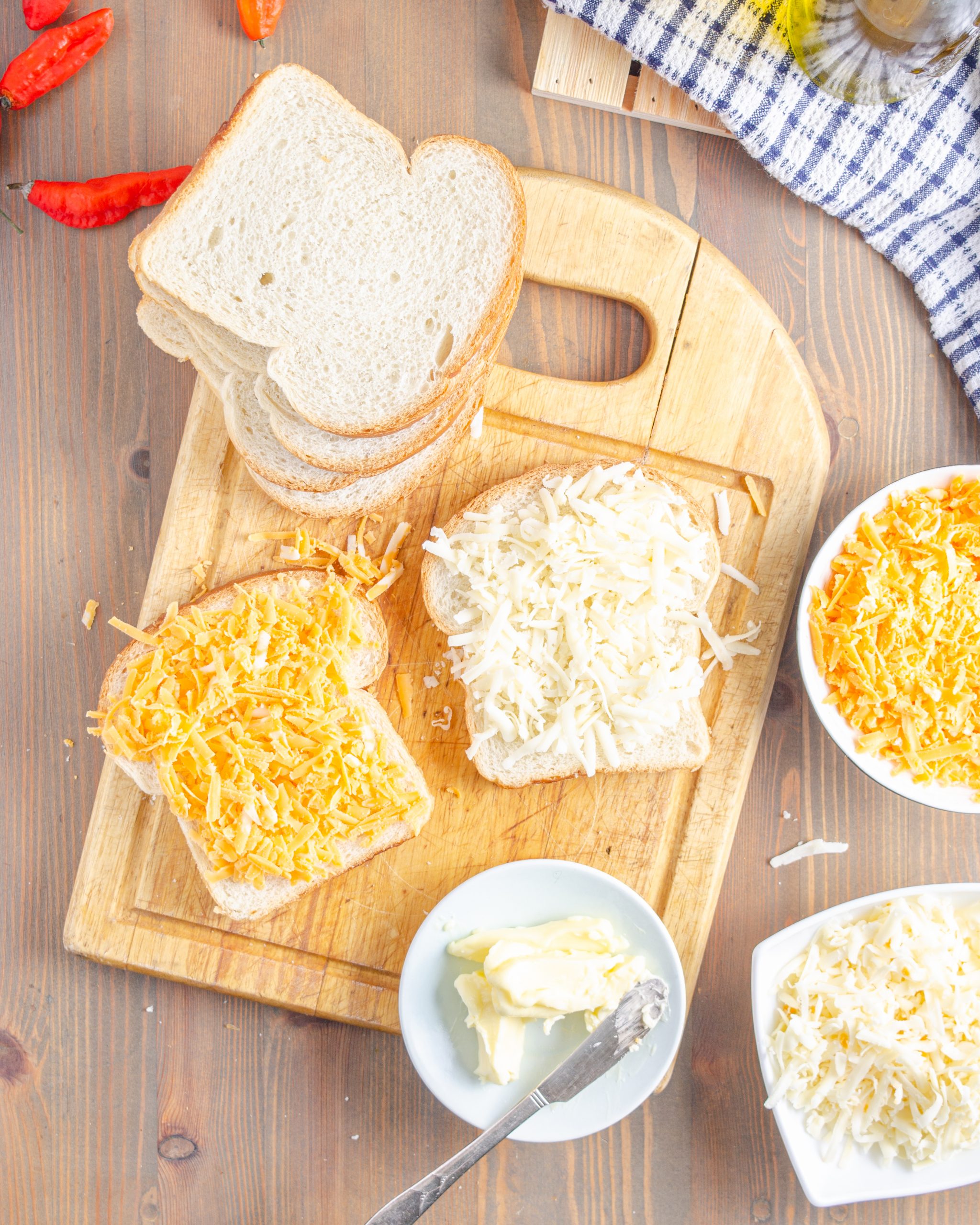 Add cheddar cheese to one of the slices of bread.