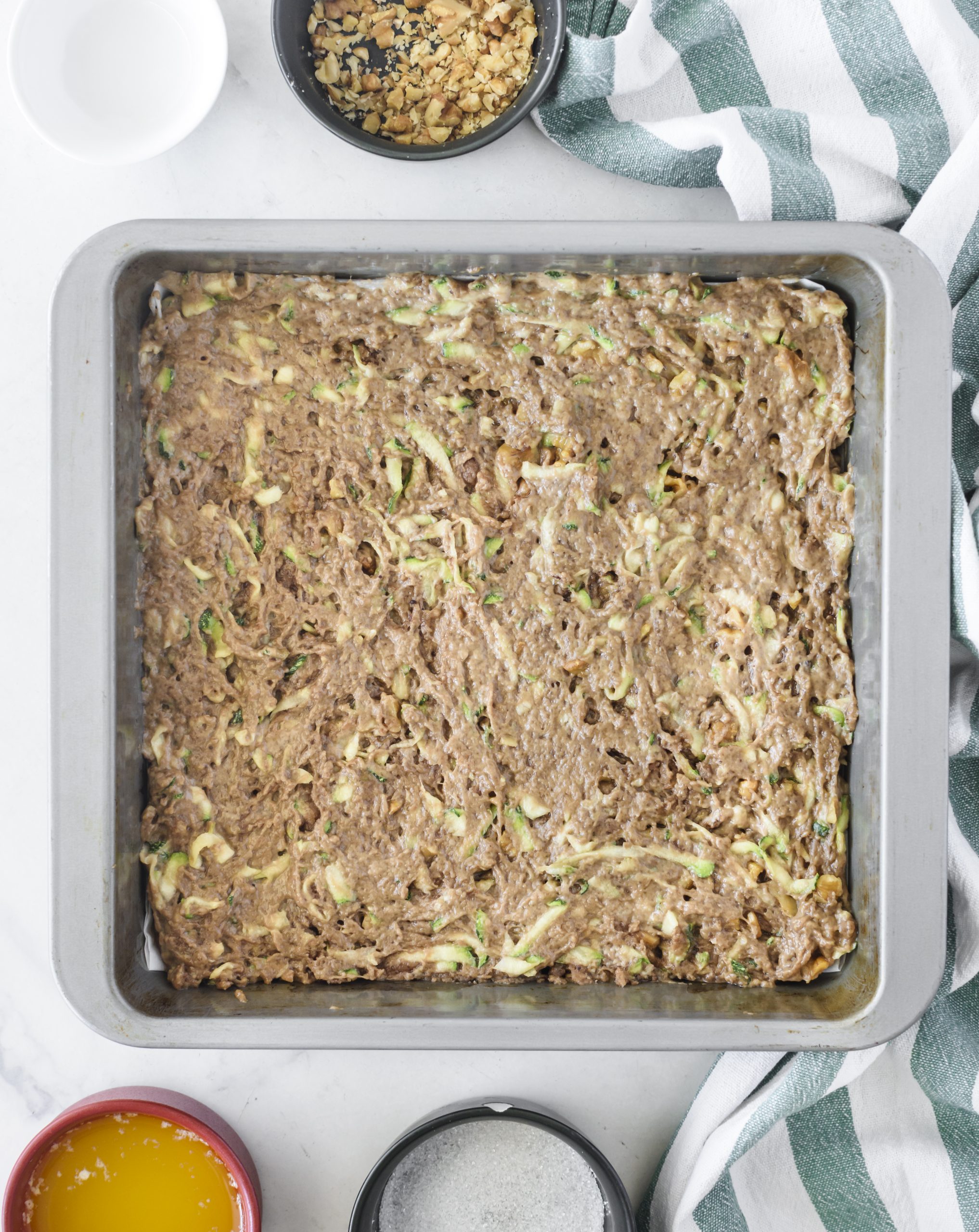 Spread the mixture into a well-greased 9x13 baking dish. 